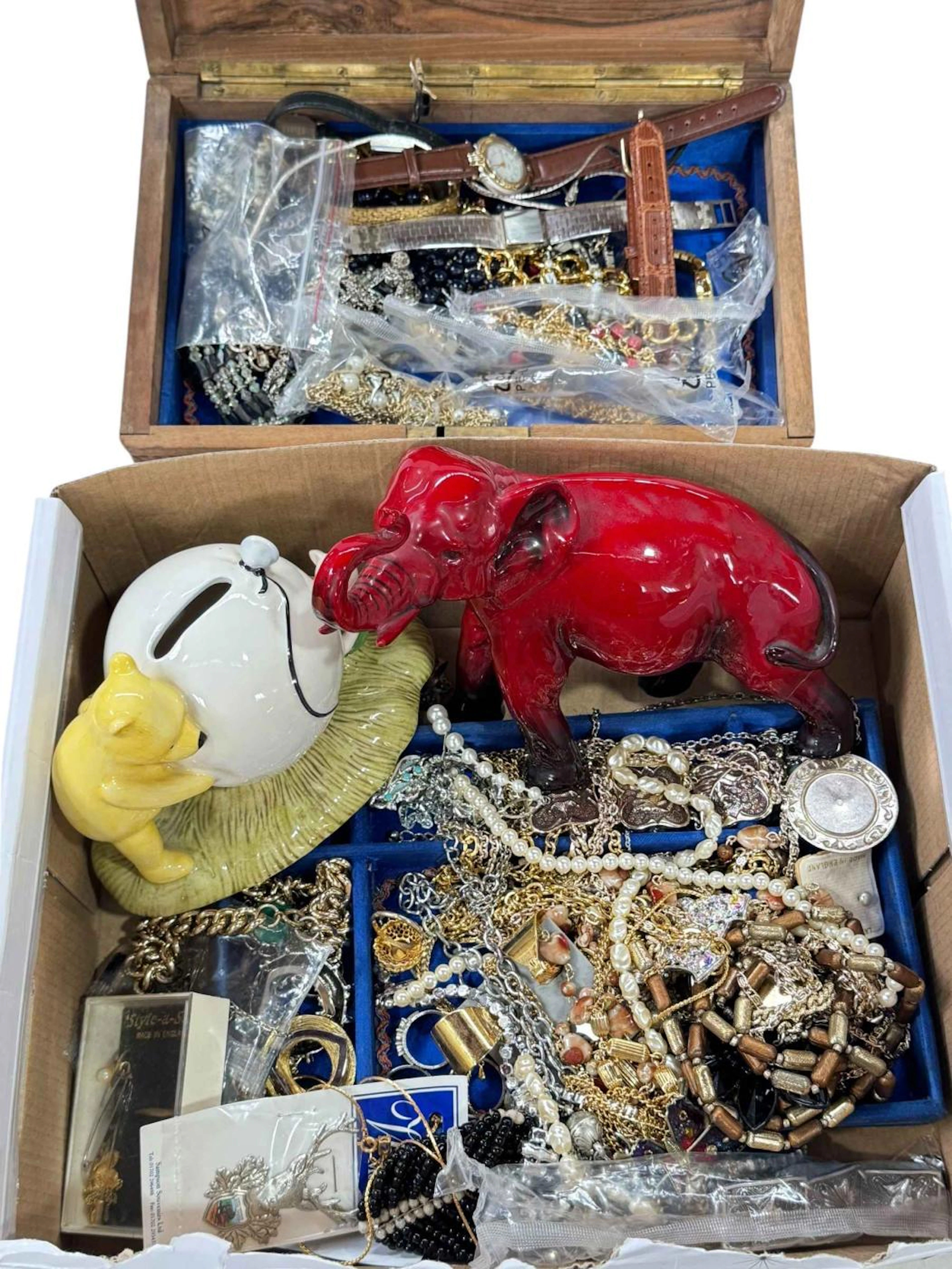 Two boxes with jewellery, watches, and Royal Doulton Flambé elephant