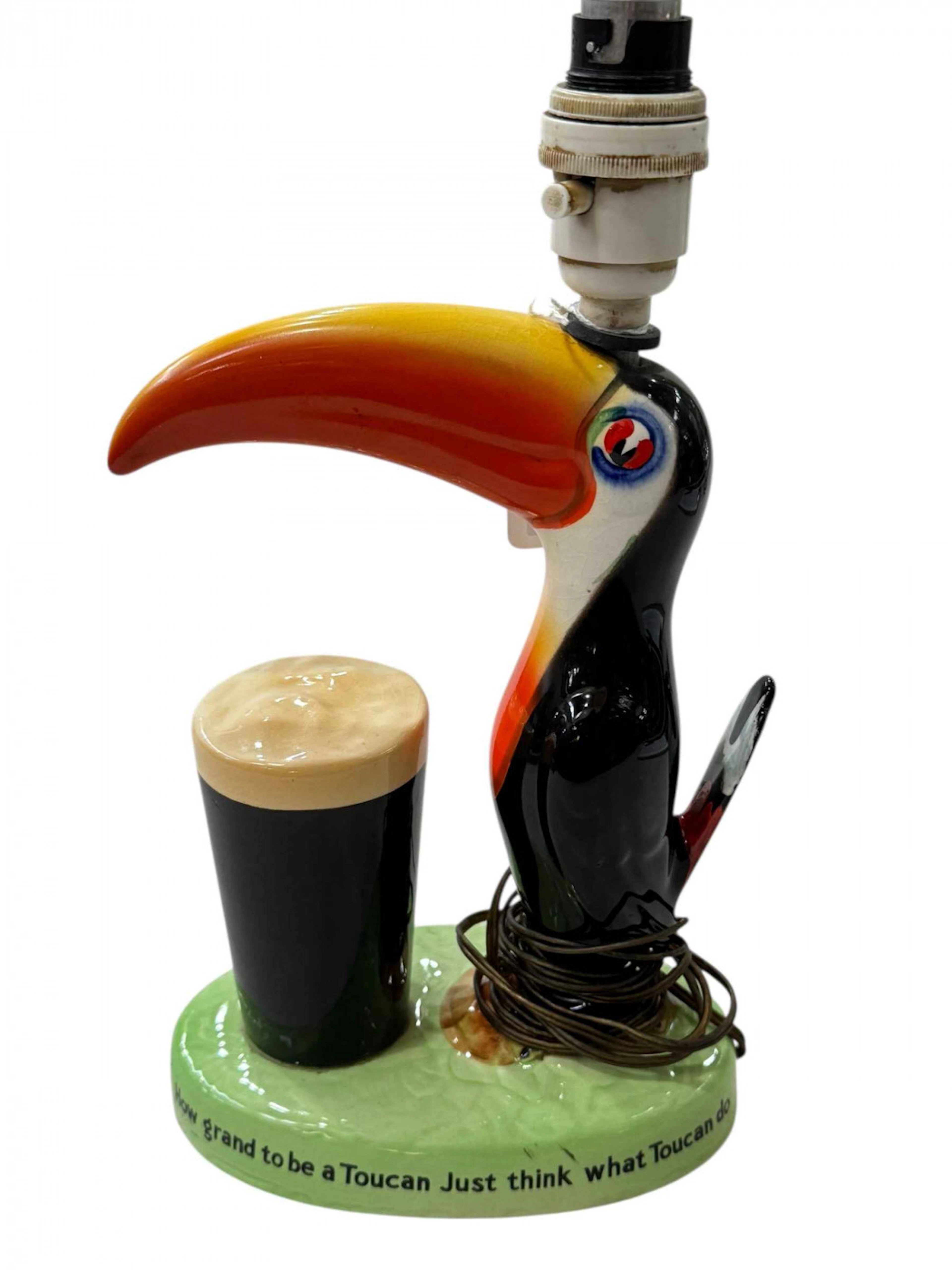 Carlton Ware Guinness Toucan table lamp, 23cm to beak.