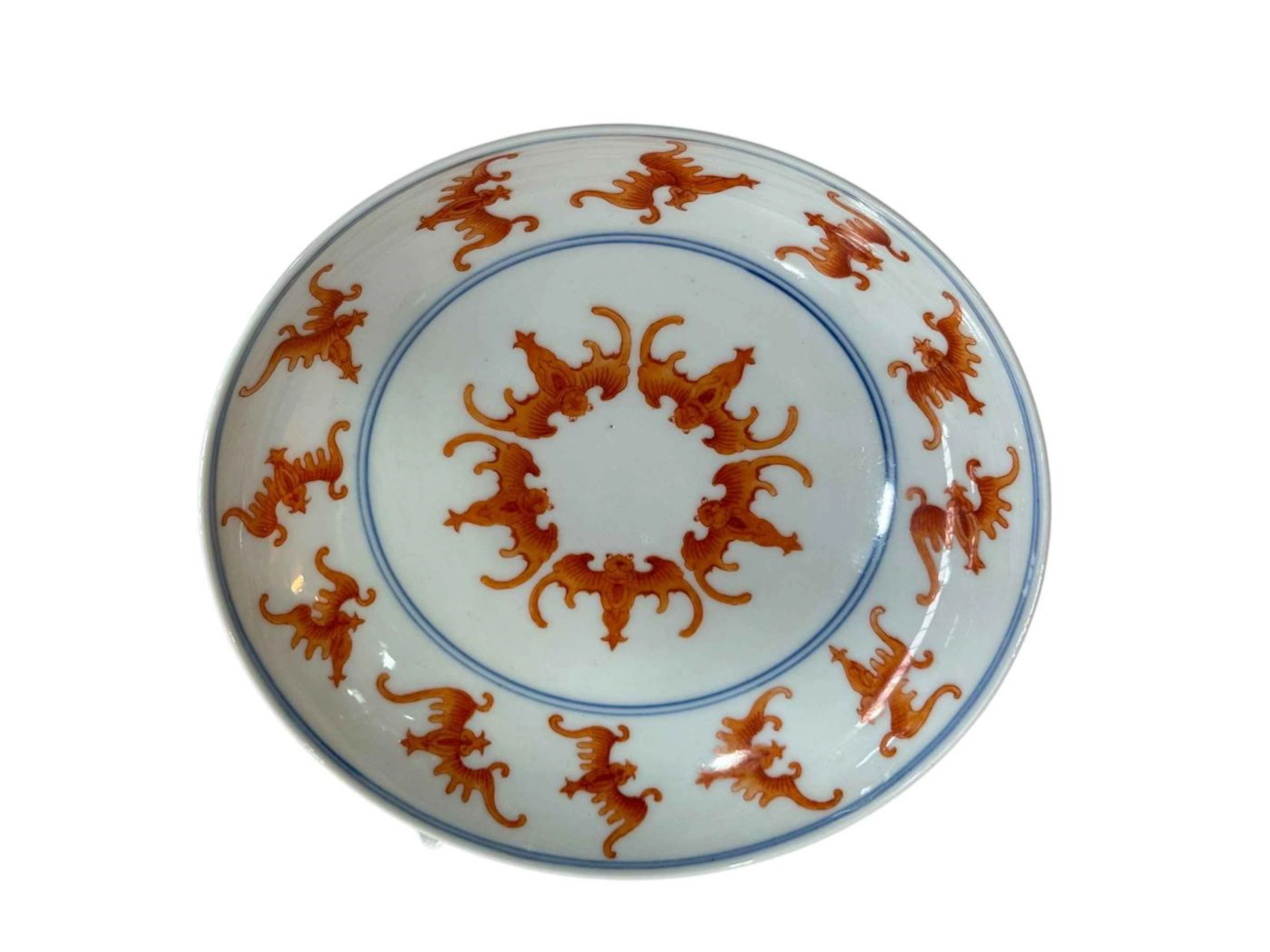 Chinese saucer dish decorated with iron red bat design with Guangxu