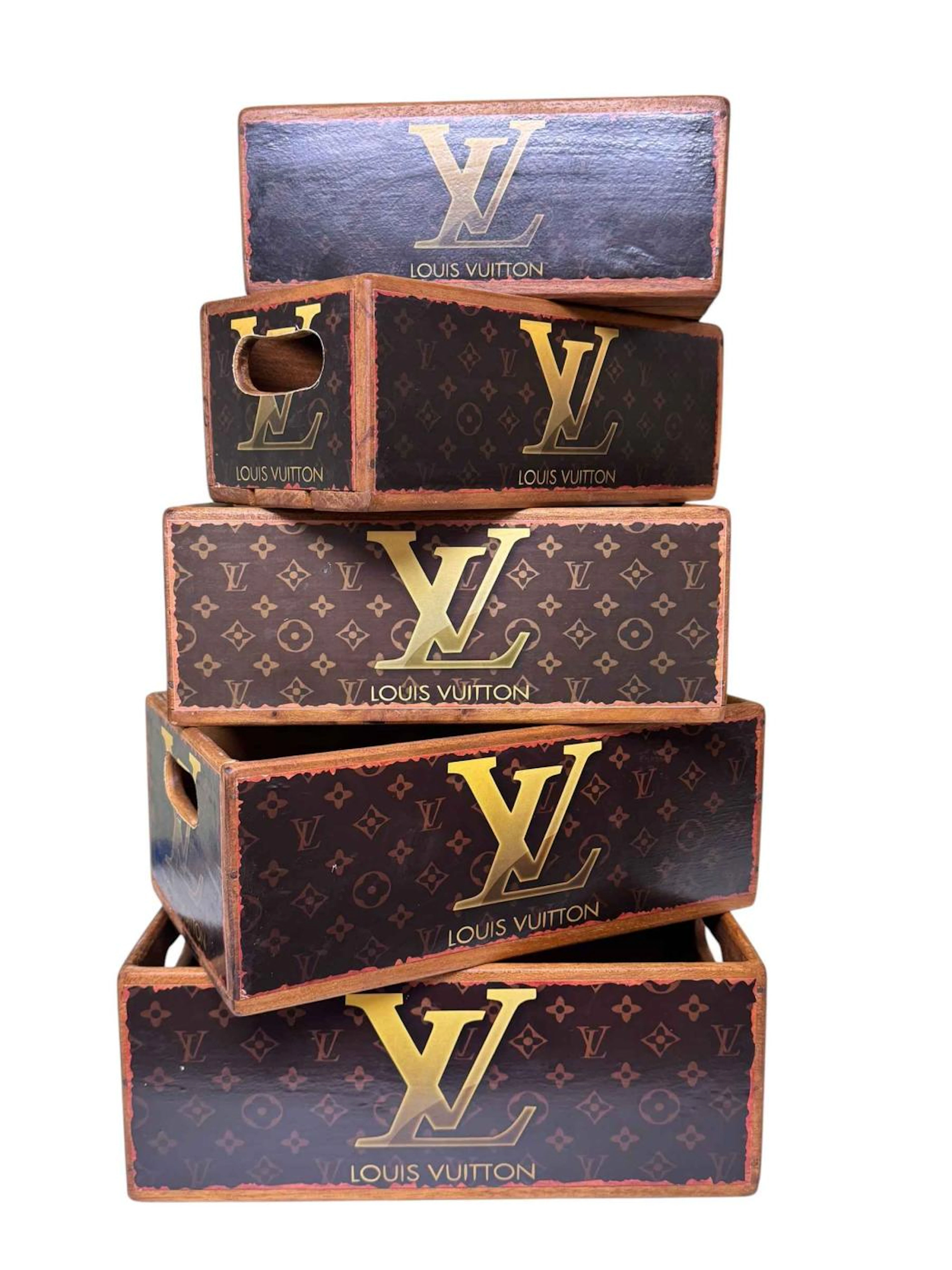 Set of five graduated Louis Vuitton advert boxes.