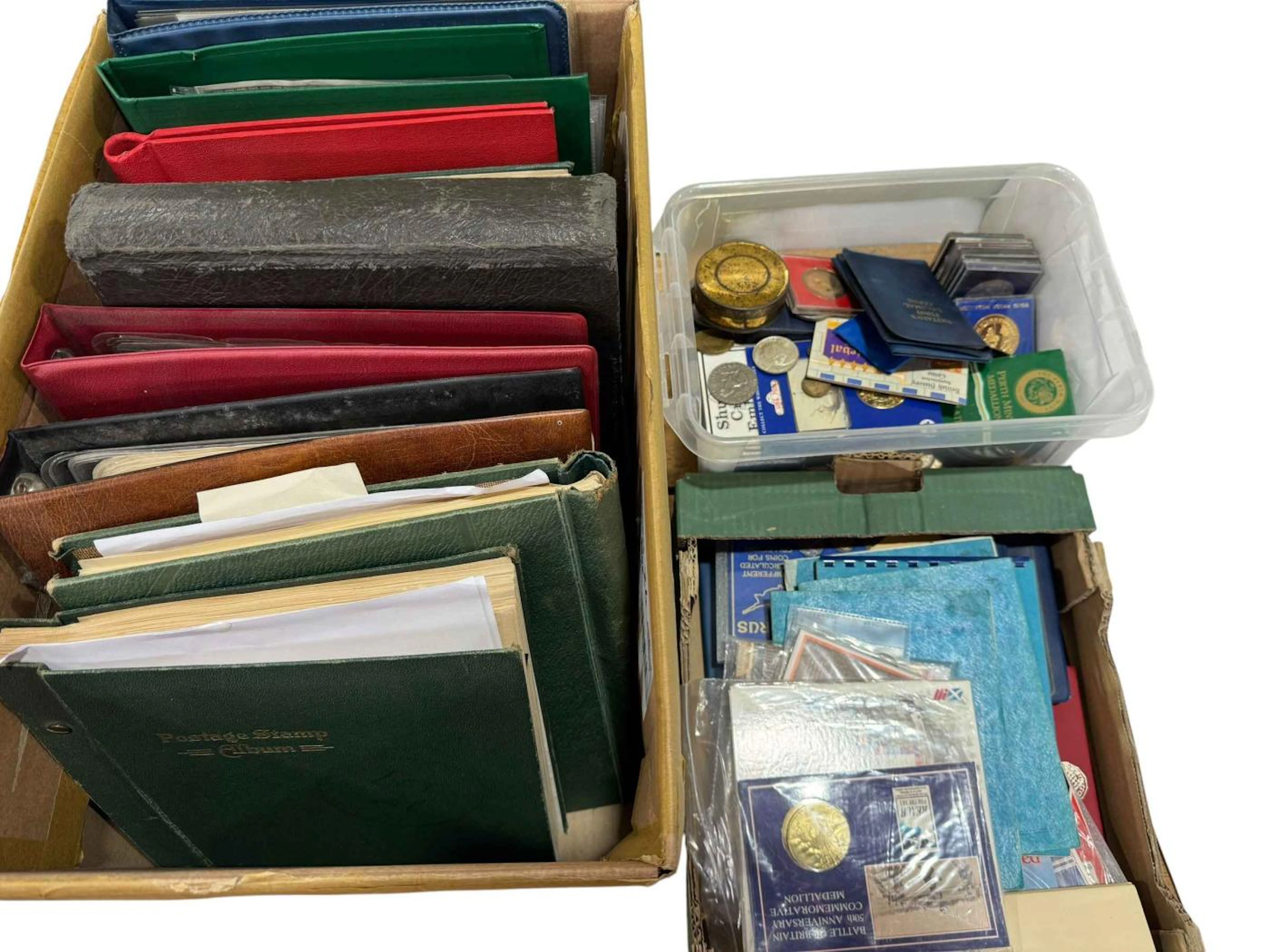Three boxes of stamps and coins in albums and loose.