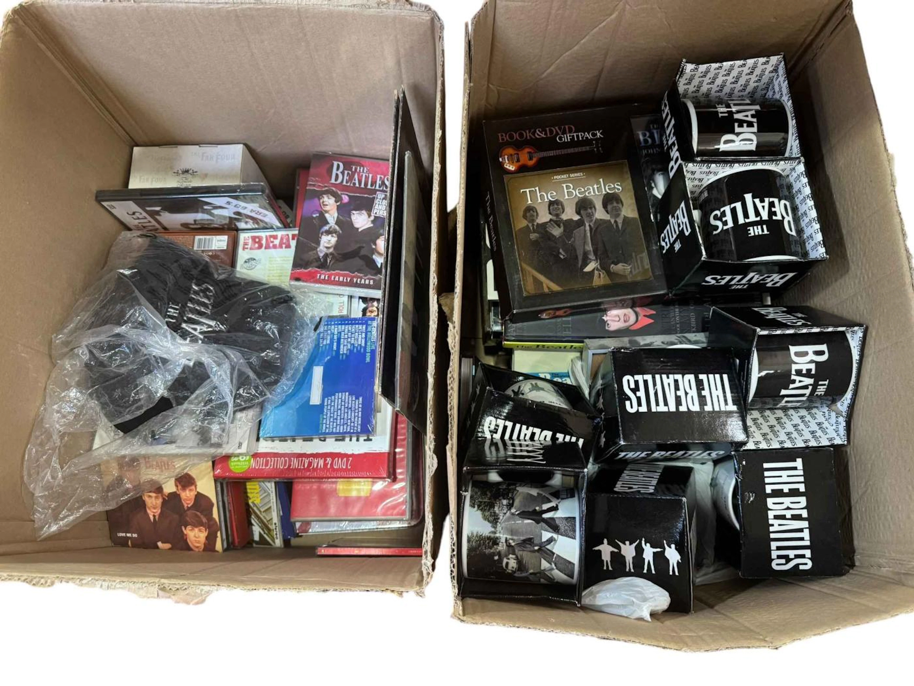 Two boxes of Beatles memorabilia.