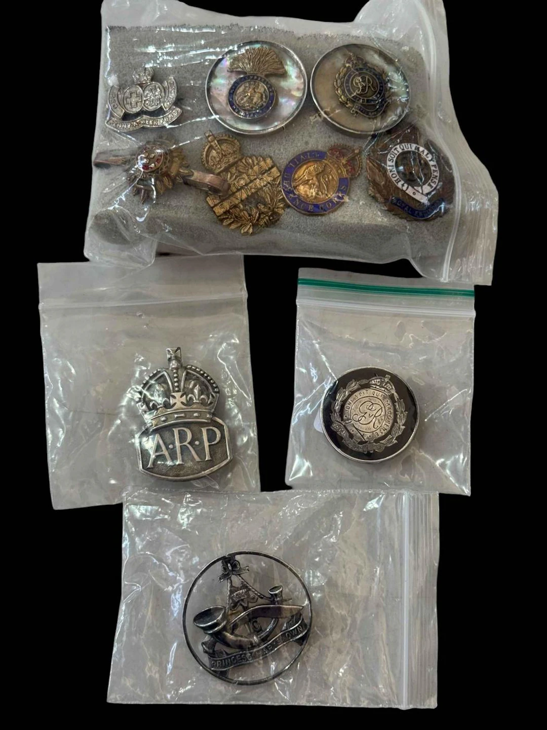 ARP and other badges including silver.