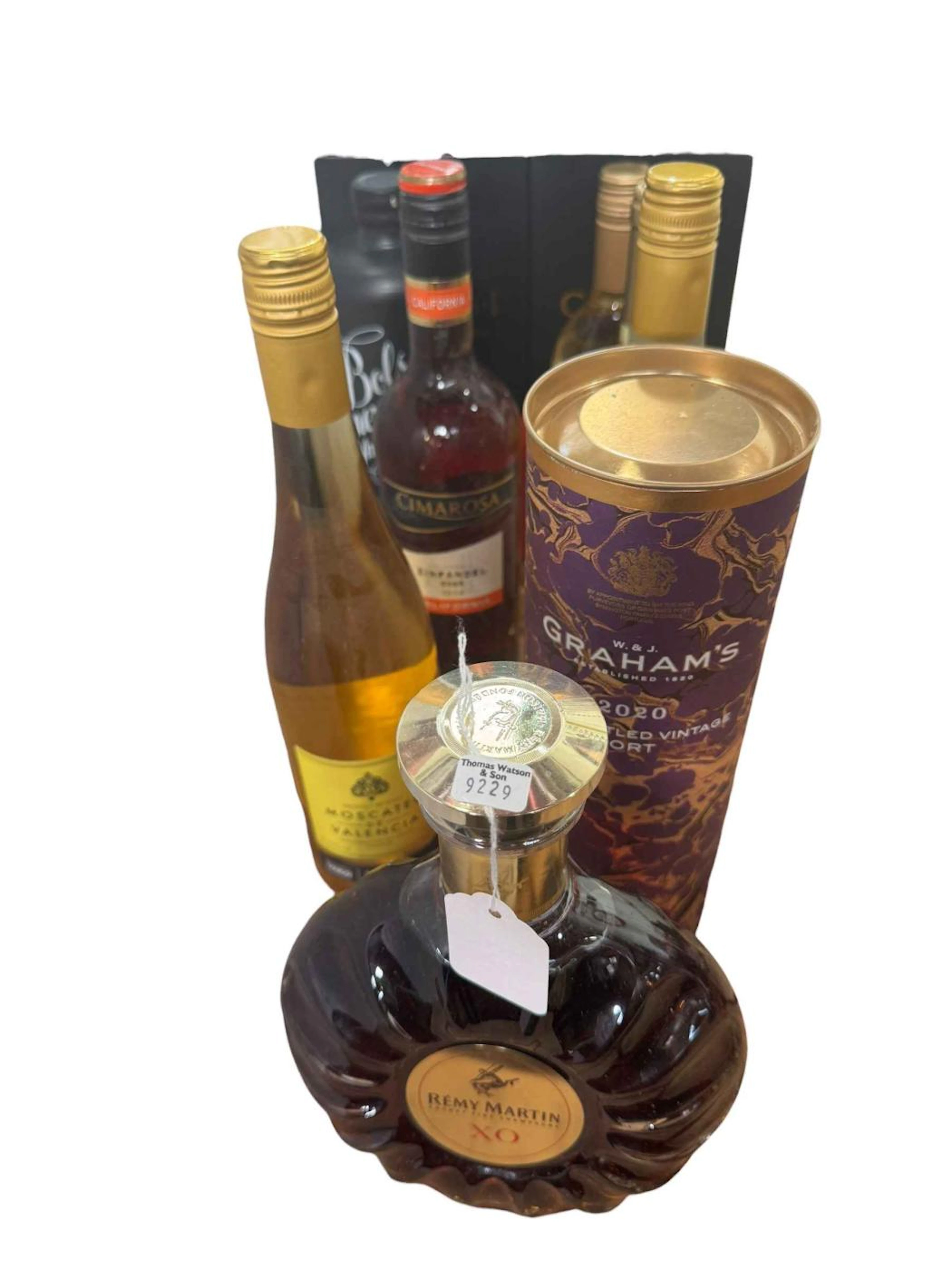 Collection of alcohol including Remy Martin Cognac, two Carlos I bottles