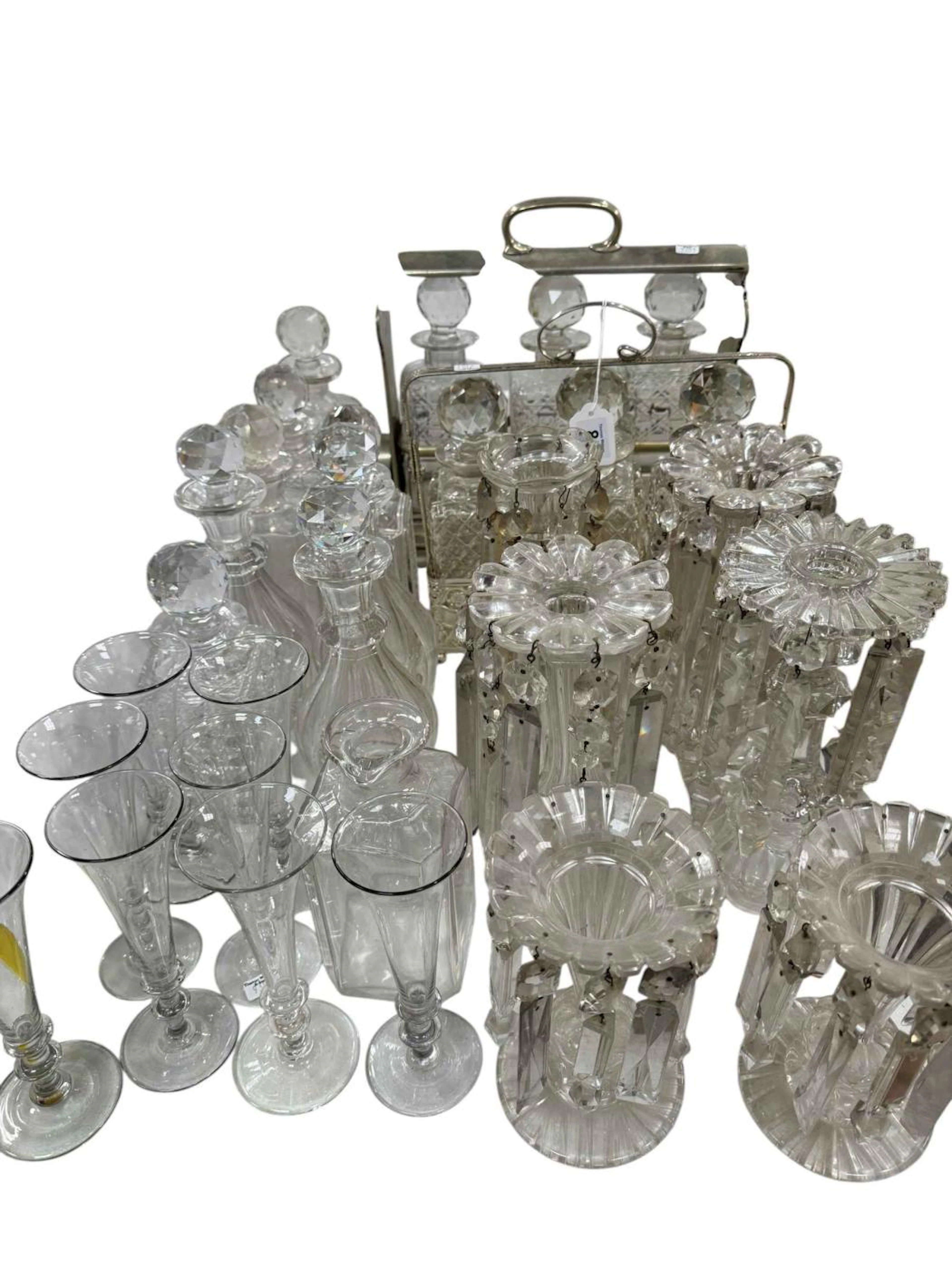 Two three bottle tantalus, six Victorian glass lustres, glass decanters