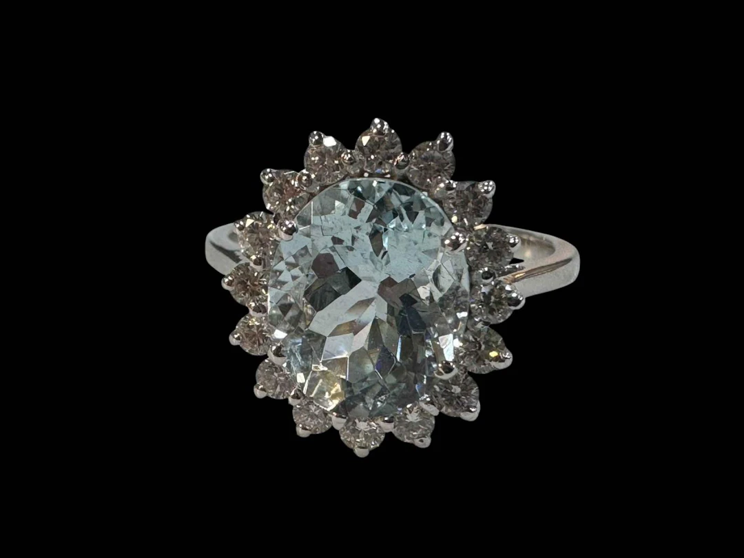 18 carat white gold aquamarine and diamond cluster rings, size O.