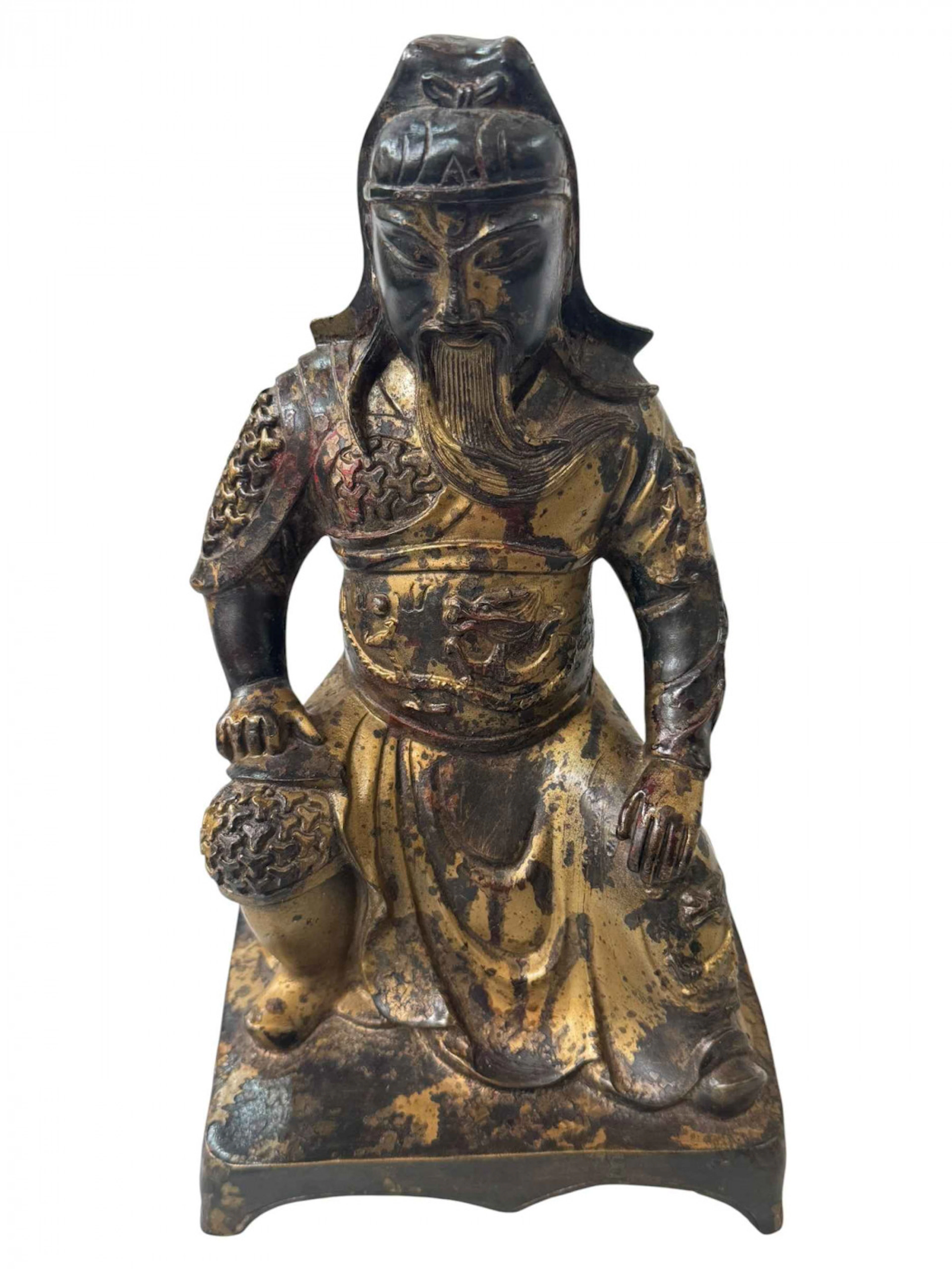 Chinese bronze figure of Guan Gong with rubbed gilt decoration, 25.5cm.