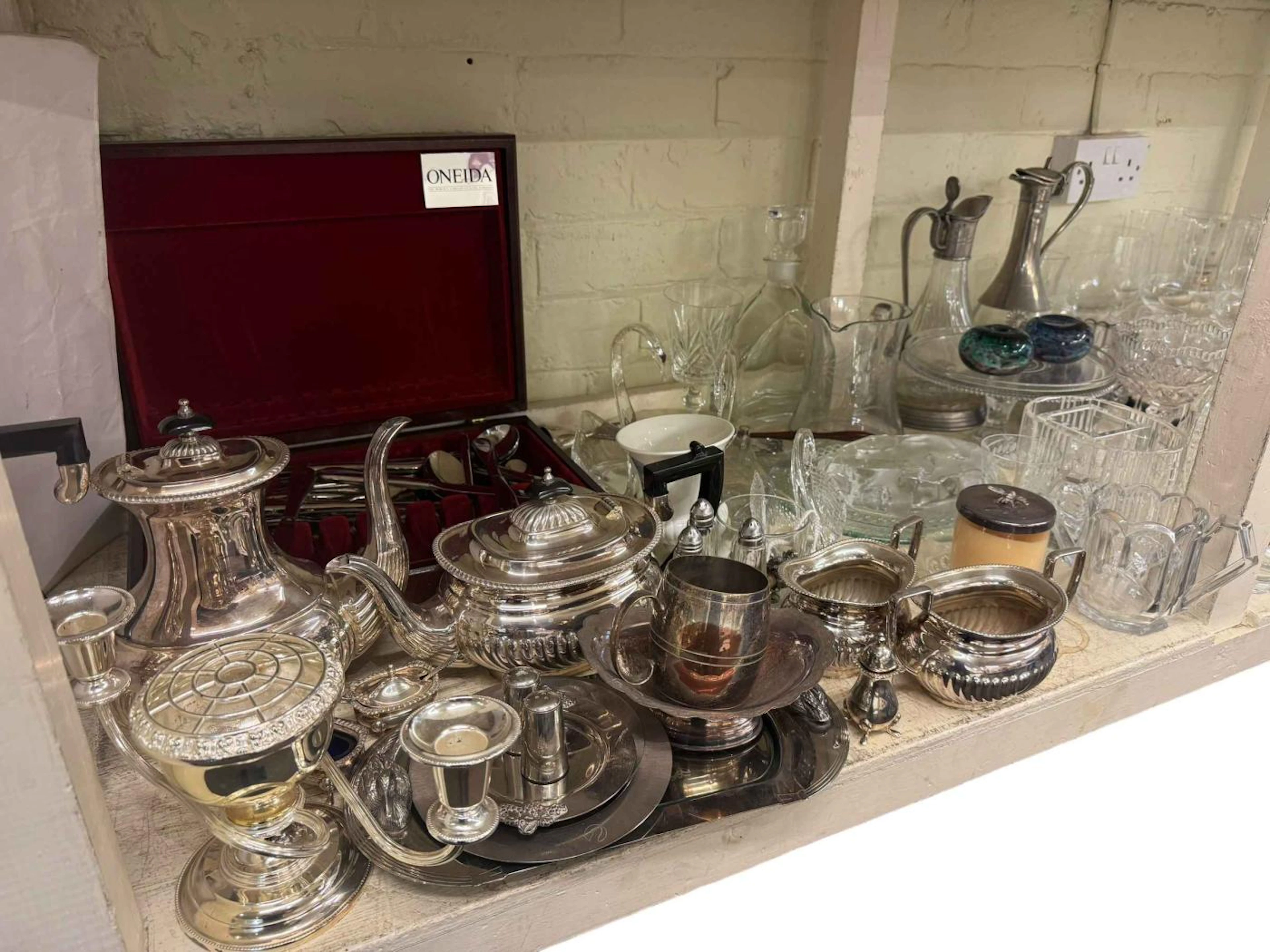 Large collection of glassware including decanters, cakestand, paperweights