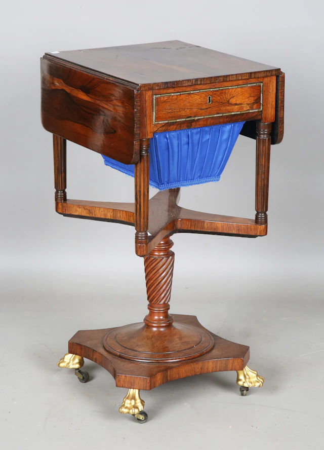 A Regency rosewood drop-flap work table, probably Irish, fitted with
