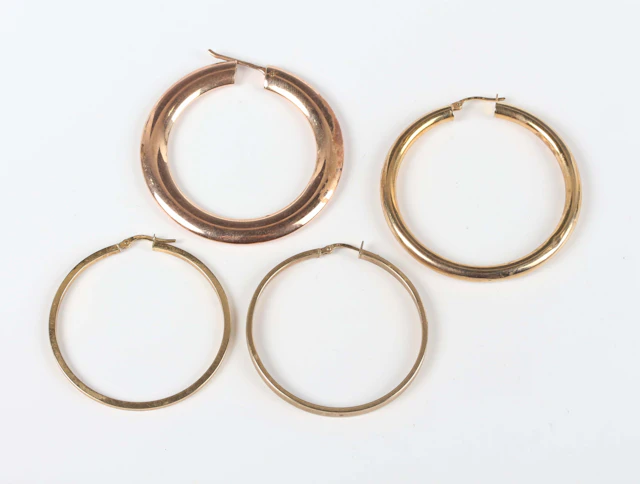 Two pairs of 9ct gold hoop shaped earrings, lengths 4.1cm and 4.5cm