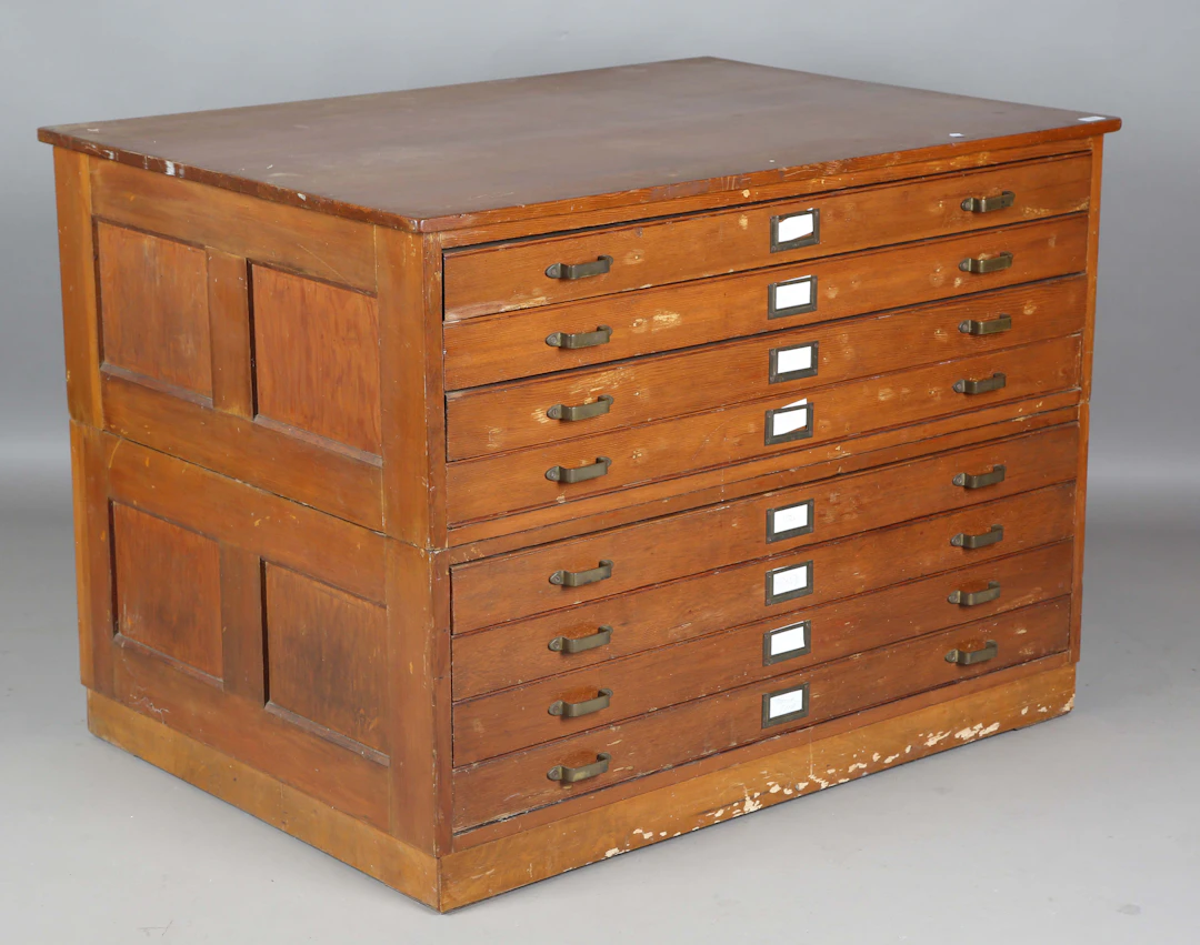 A mid-20th century pine planner's or folio chest of eight drawers