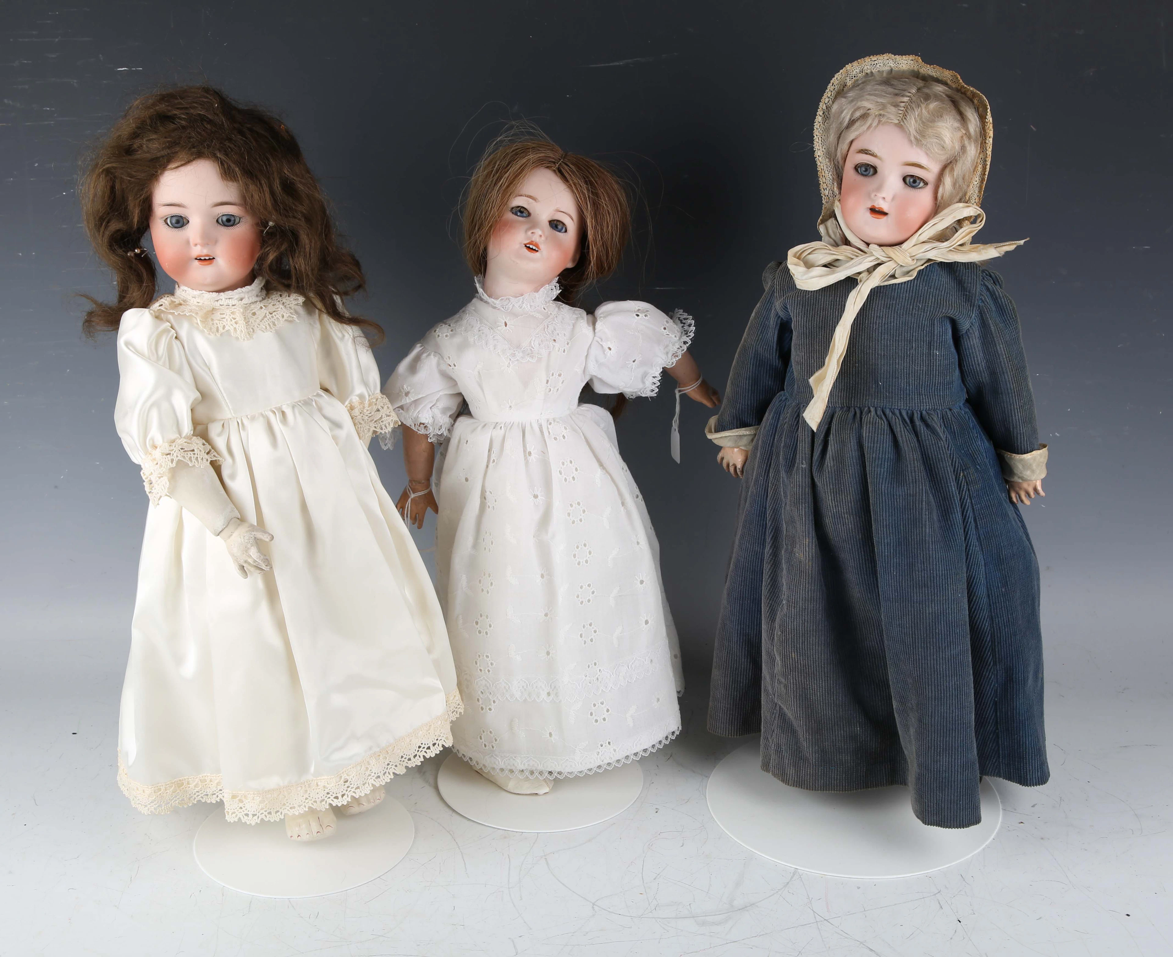 A Handwerck bisque head doll with blonde wig, sleeping blue eyes