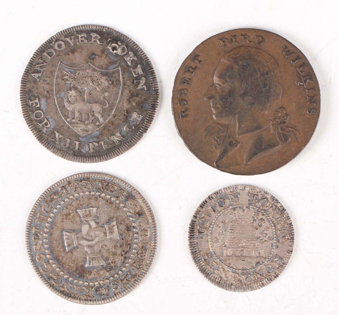 A small group of 18th and 19th century tokens, including a silver