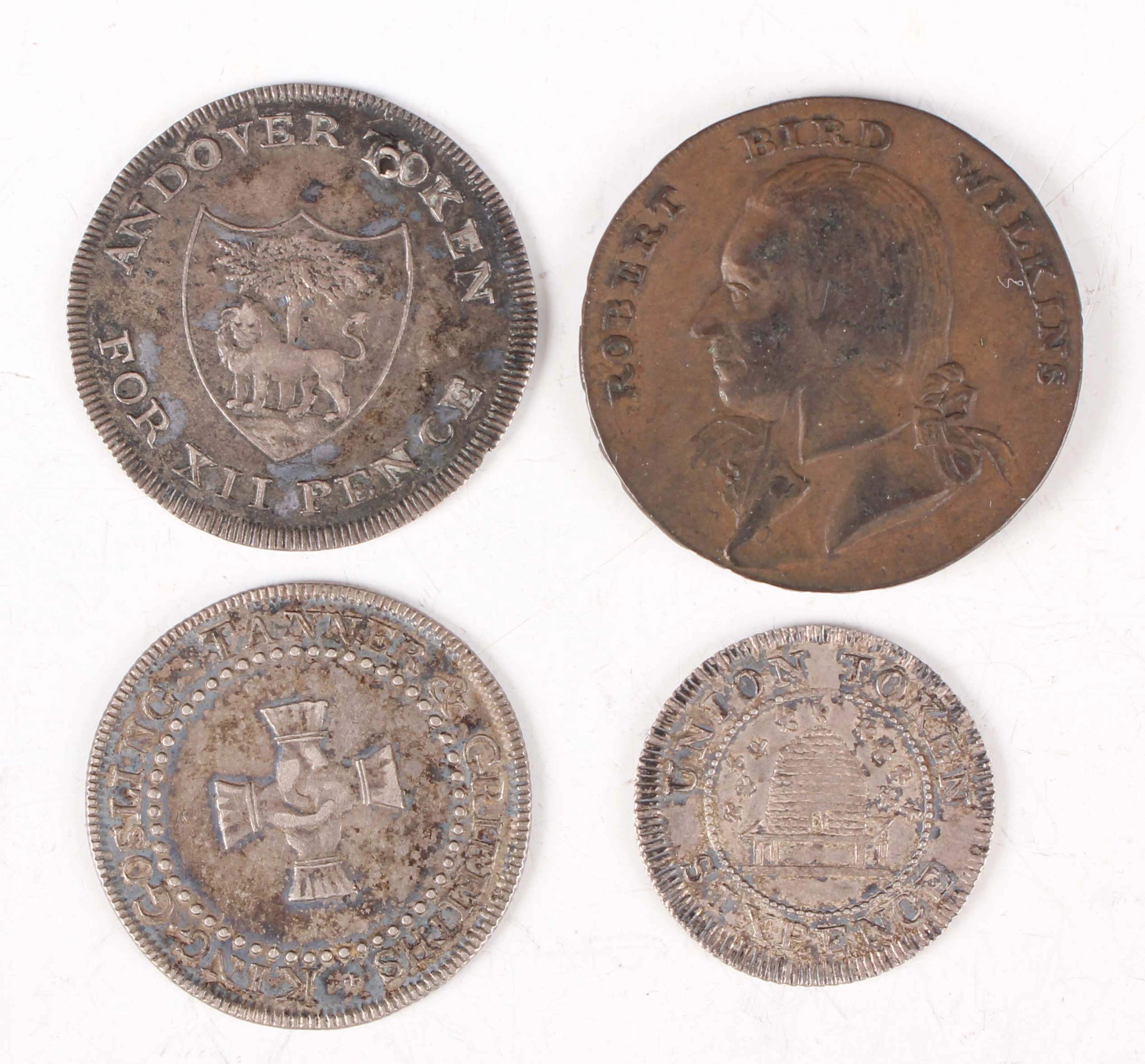 A small group of 18th and 19th century tokens, including a silver