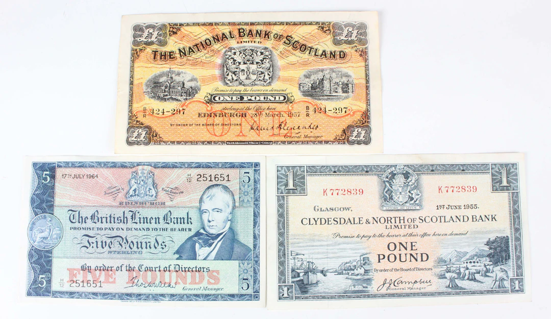 A collection of Scottish banknotes, including a National Bank of Scotland