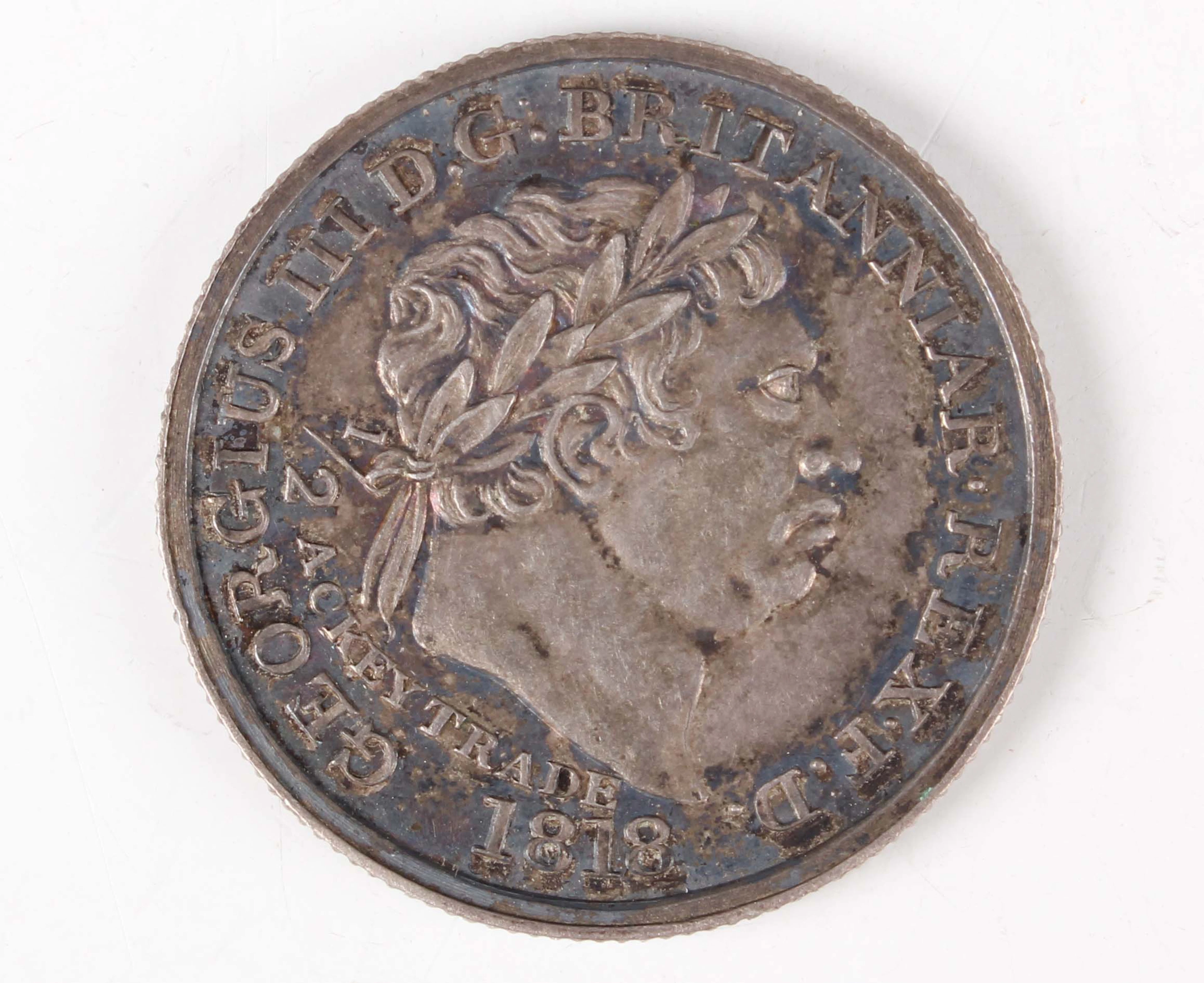 A scarce Gold Coast George III half-ackey 1818 (extremely fine, toned