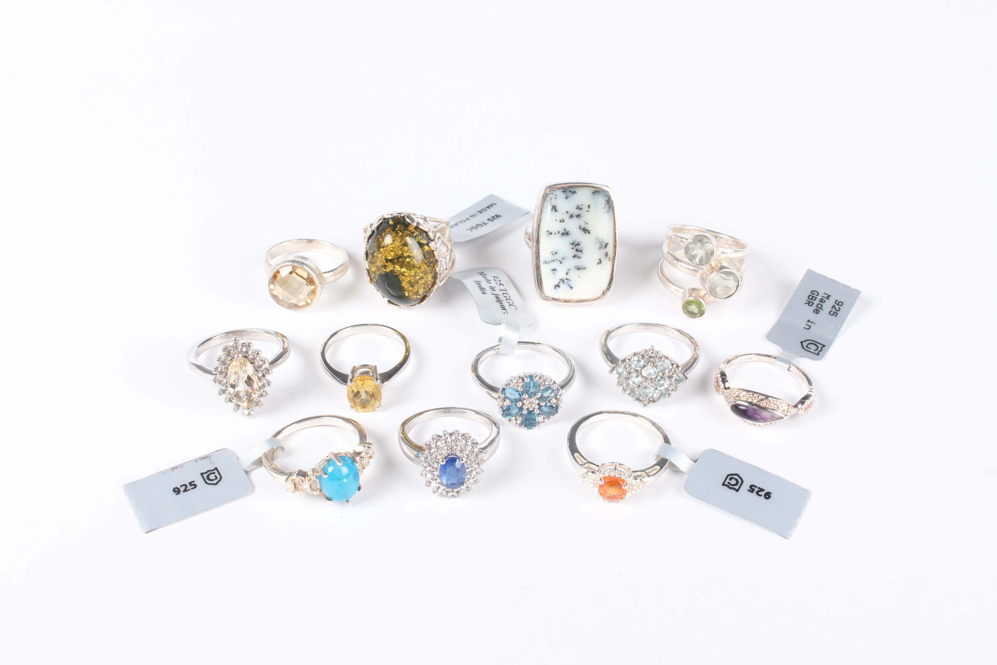 Twelve silver and gem set rings, including a mandarin garnet and white