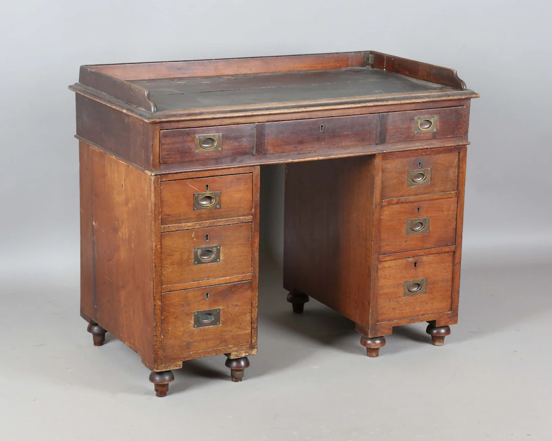 A late Victorian mahogany twin-pedestal campaign desk by Arthur Foley