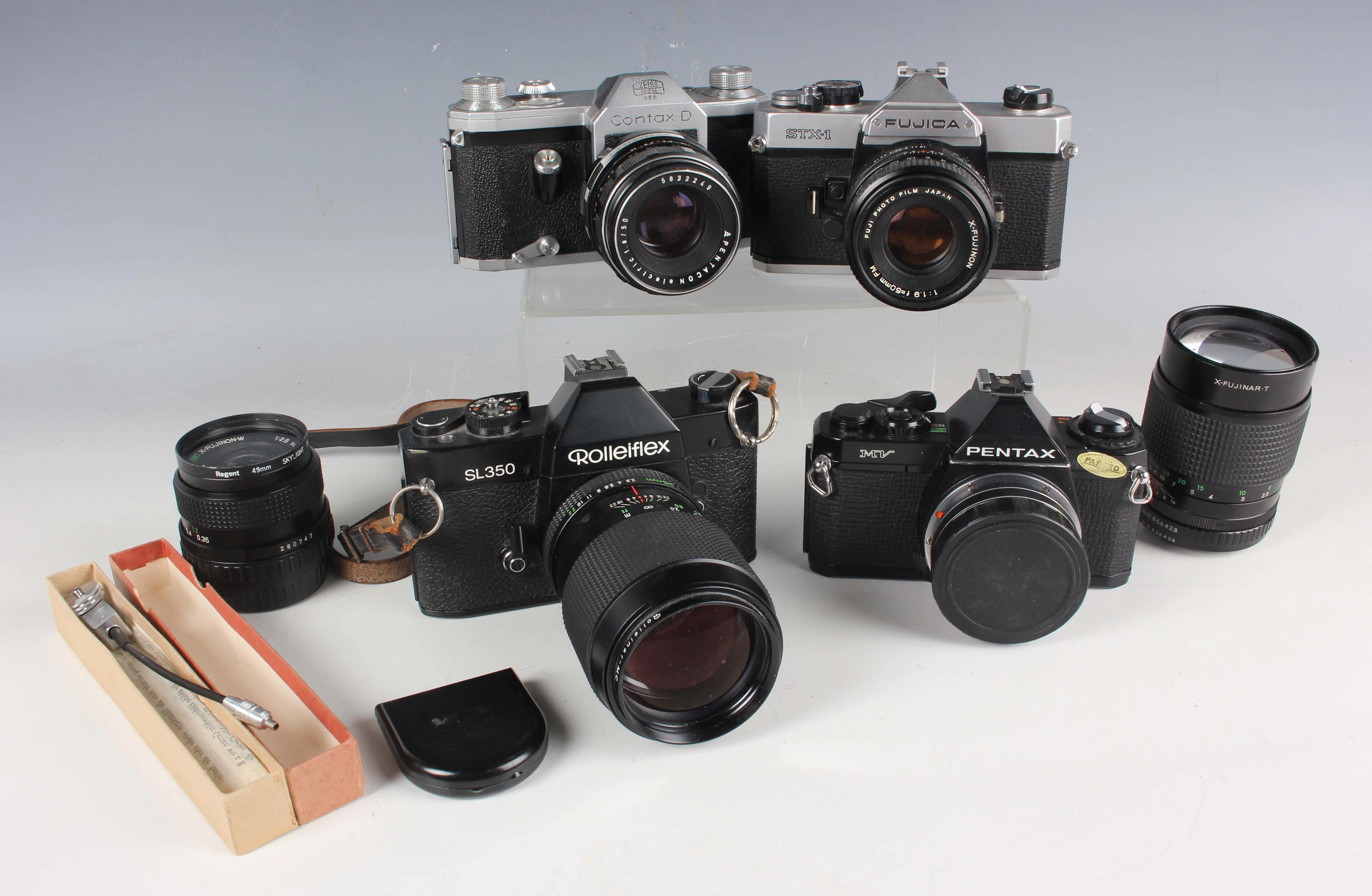 A Zeiss Ikon Contax D 35mm SLR camera with Pentacon 1:8/50 lens, a