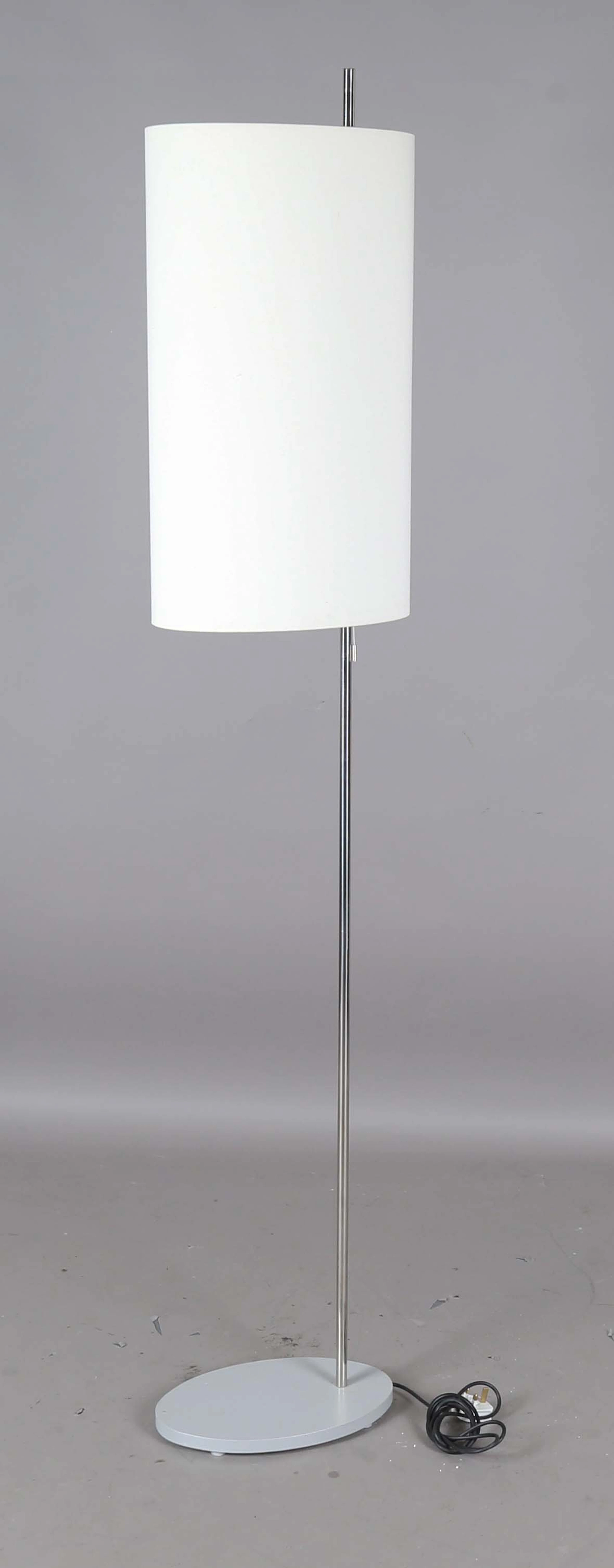 A late 20th century chromium plated metal twin-light floor lamp, designed