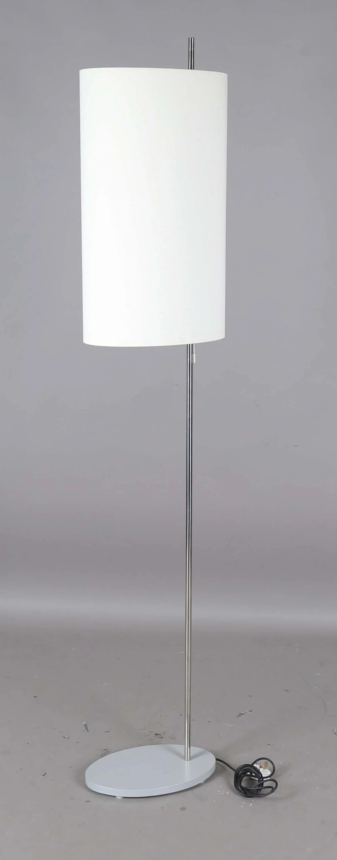 A late 20th century chromium plated metal twin-light floor lamp, designed