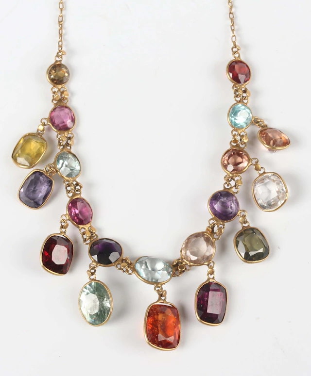 A gold and varicoloured gemstone necklace, the front with a row of