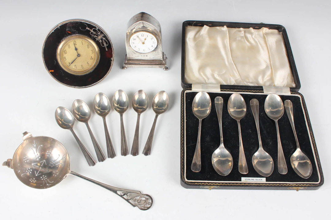 A small group of silver and silver mounted items, including a tea