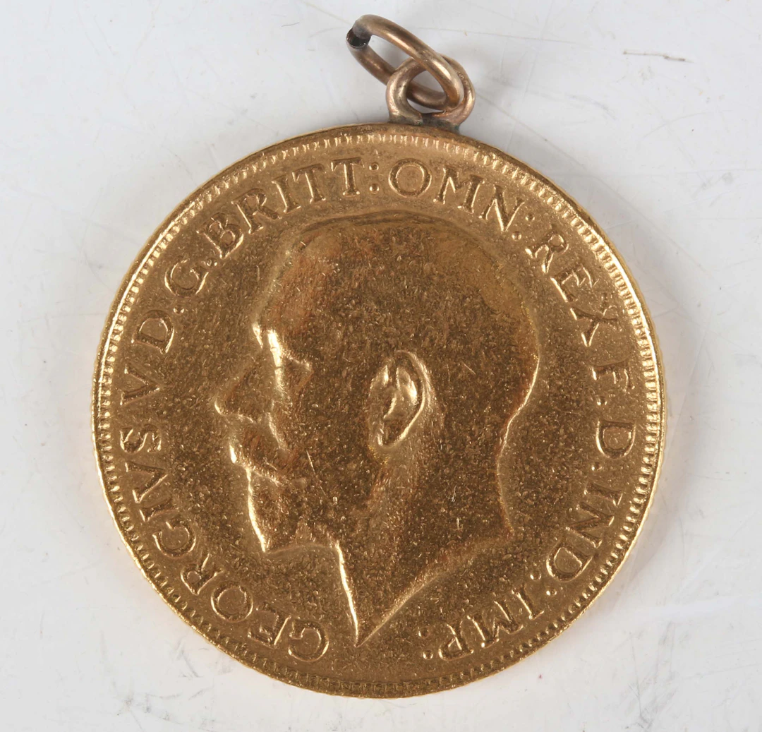 A George V sovereign 1928, South Africa Mint, fitted with a suspension ring.