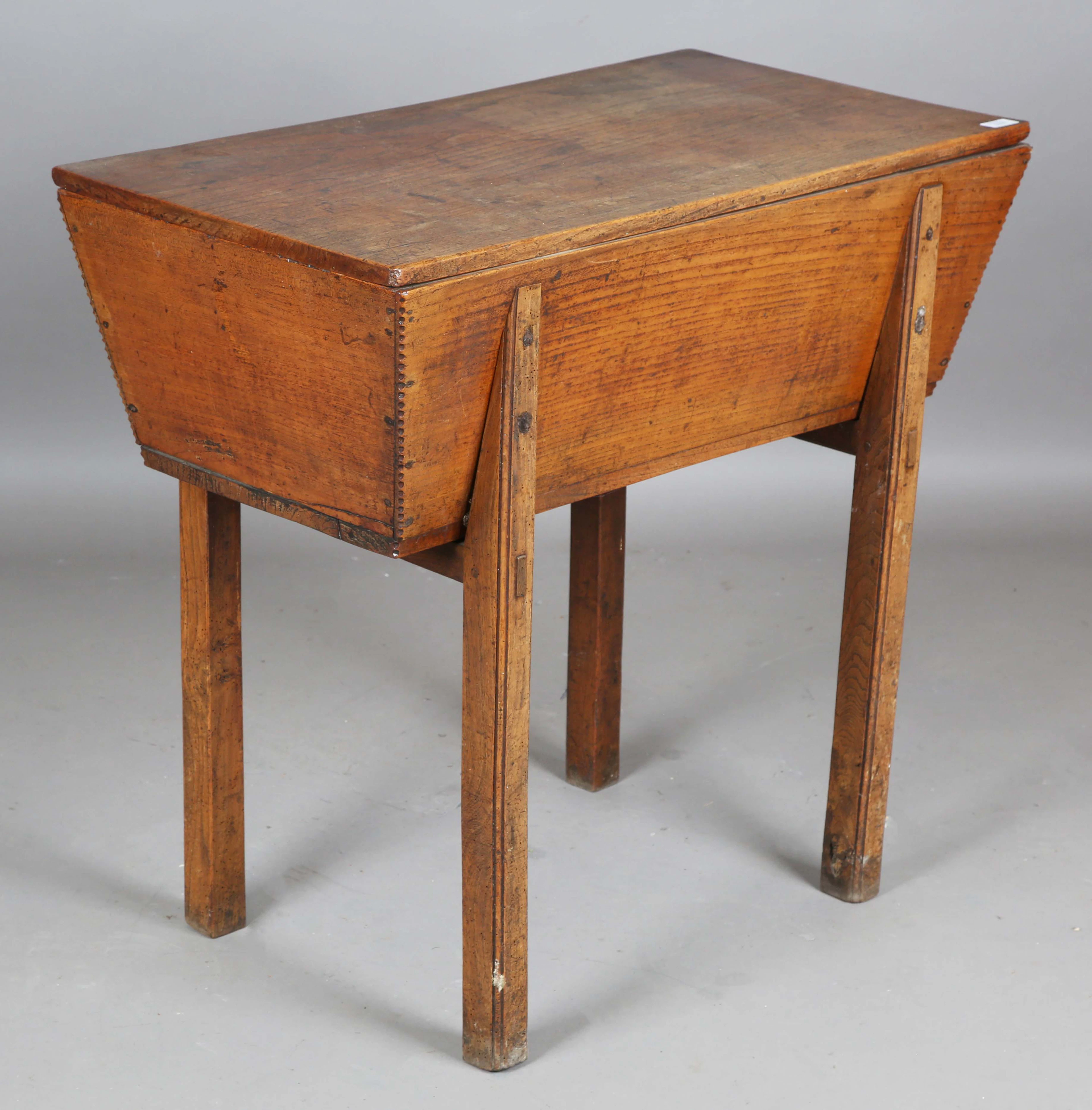A 19th century provincial elm dough bin, raised on block legs, height