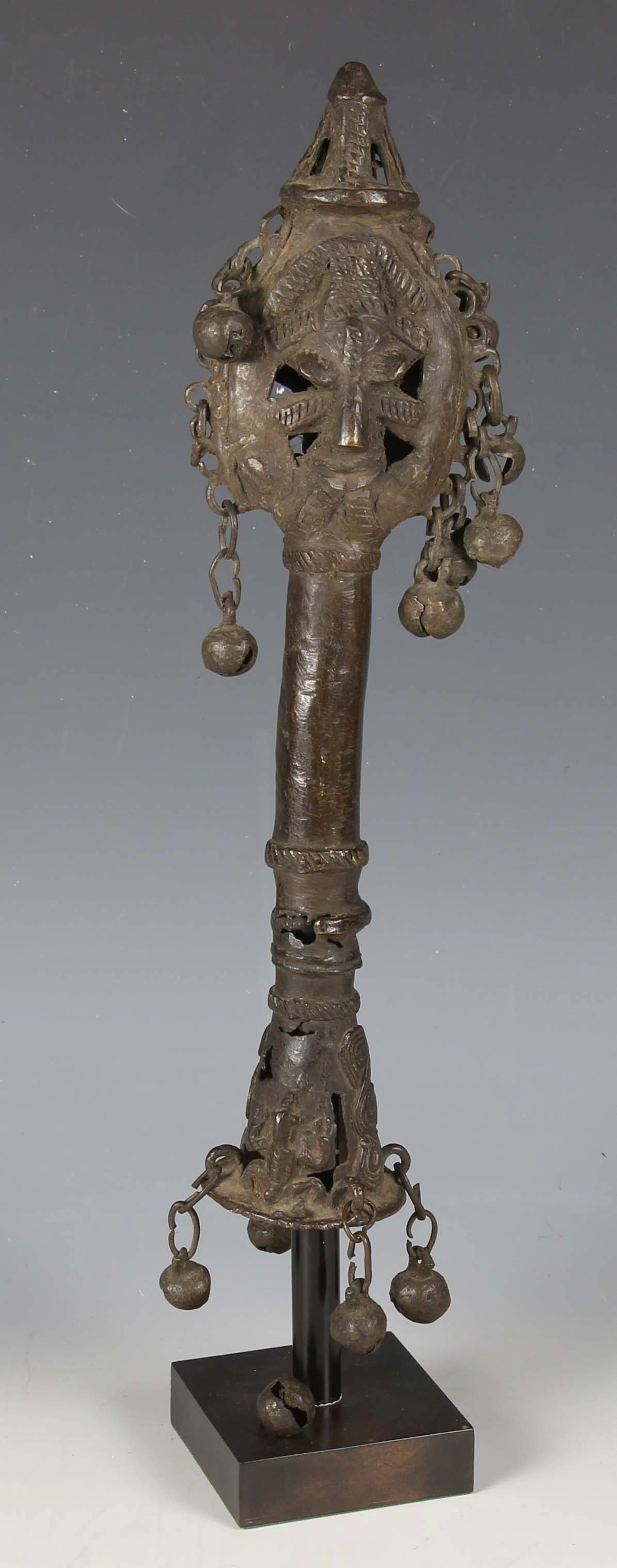 A Yoruba Edan cast bronze staff finial, West Africa, the pierced leaf