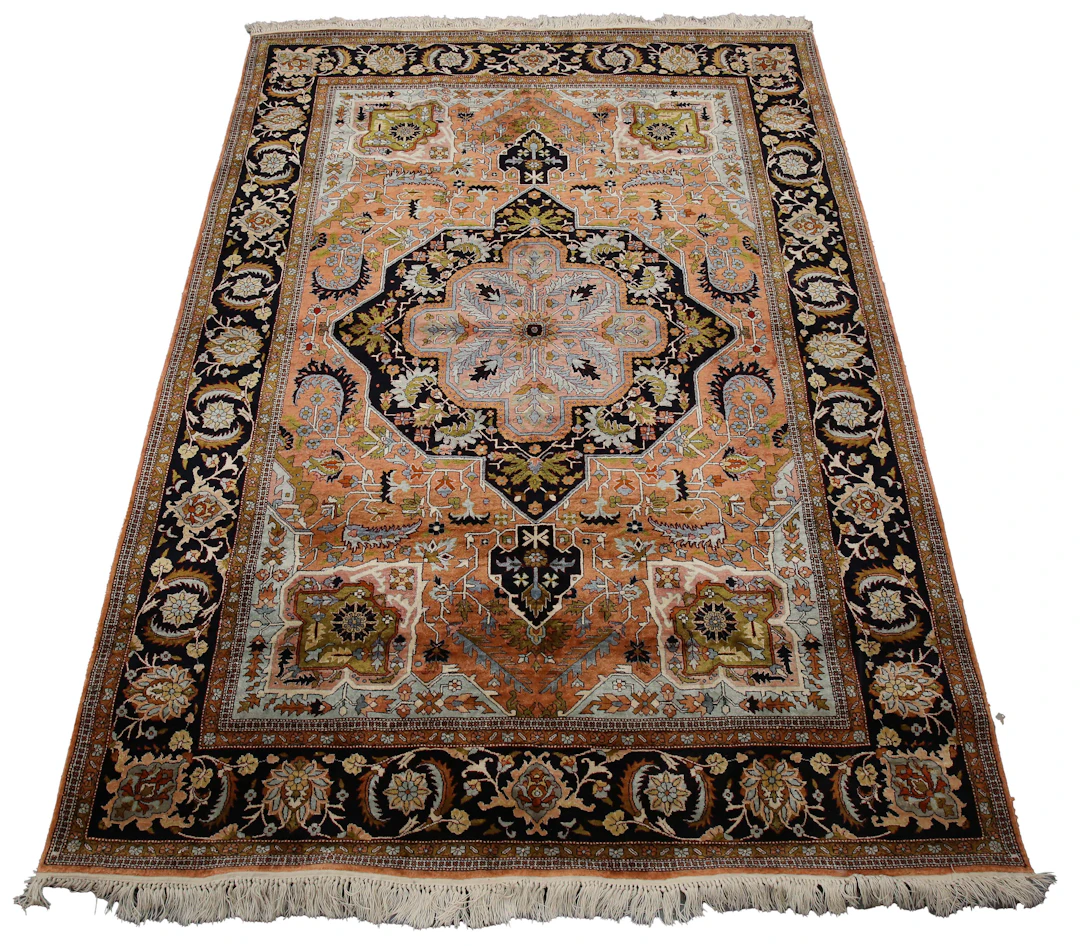 A Qum part silk rug, Central Persia, late 20th century, the dark salmon