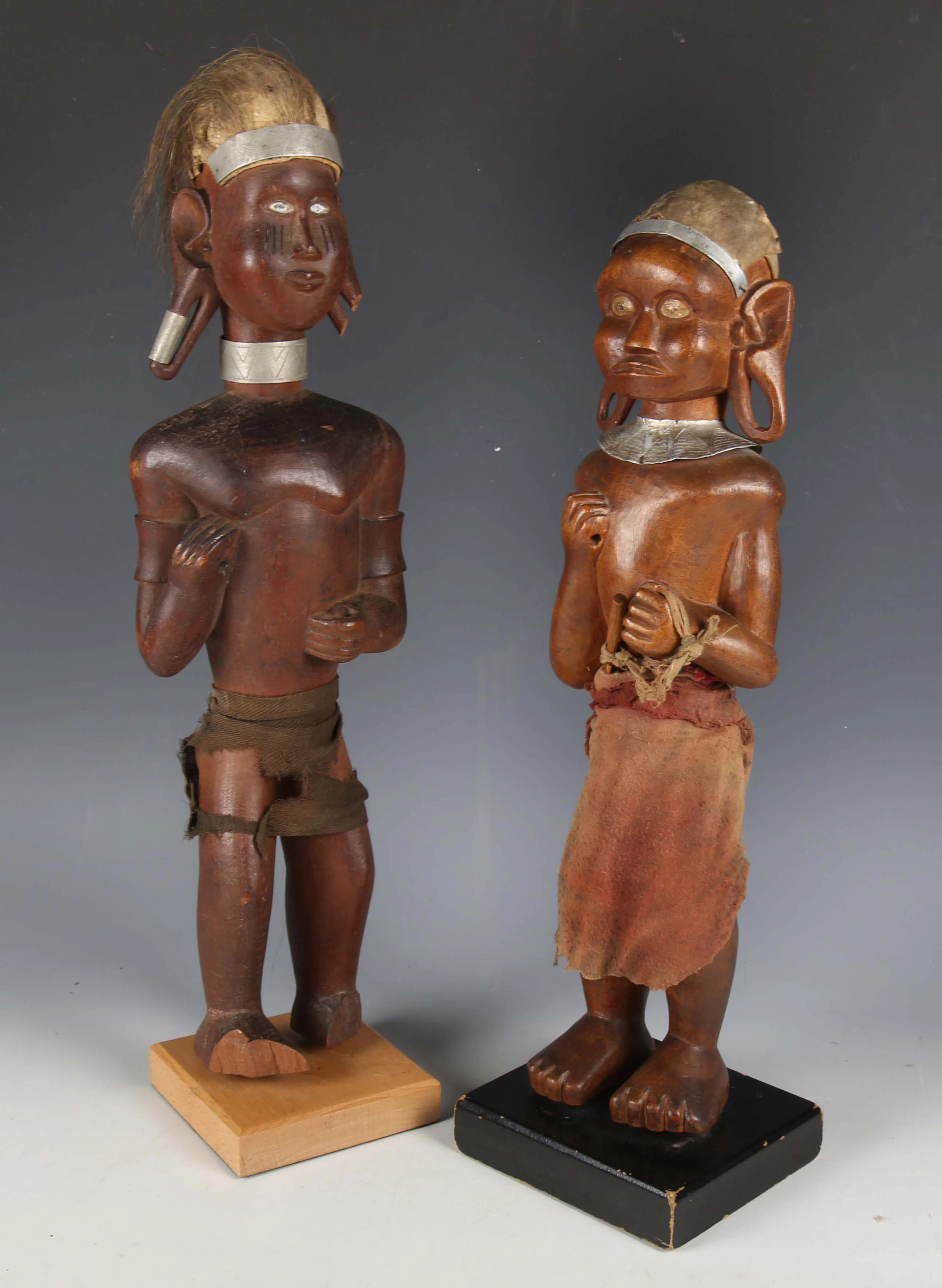 A Kamba carved wooden standing male figure, Kenya, with applied hair
