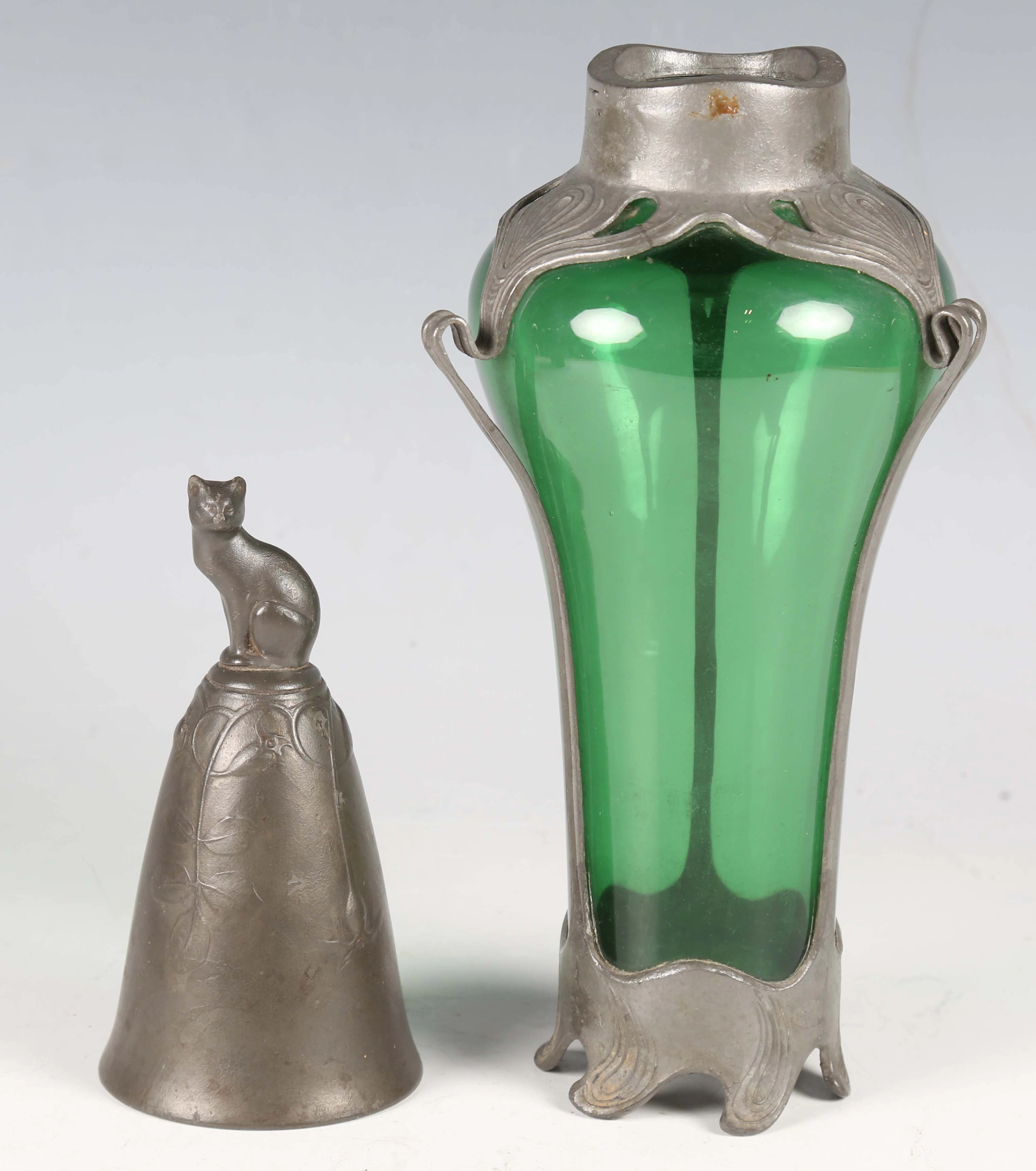 An Art Nouveau Kayserzinn pewter bell, cast with a cat finial and