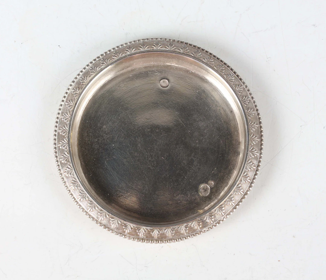 A late 18th century French miniature toy silver circular tray with