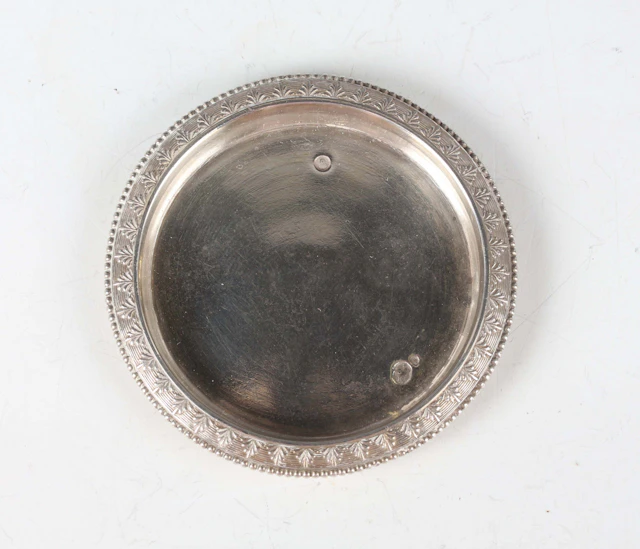 A late 18th century French miniature toy silver circular tray with