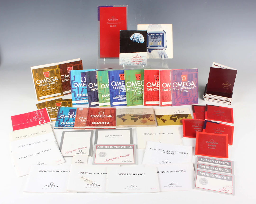 A collection of Omega wristwatch instruction manuals, guarantee certificate