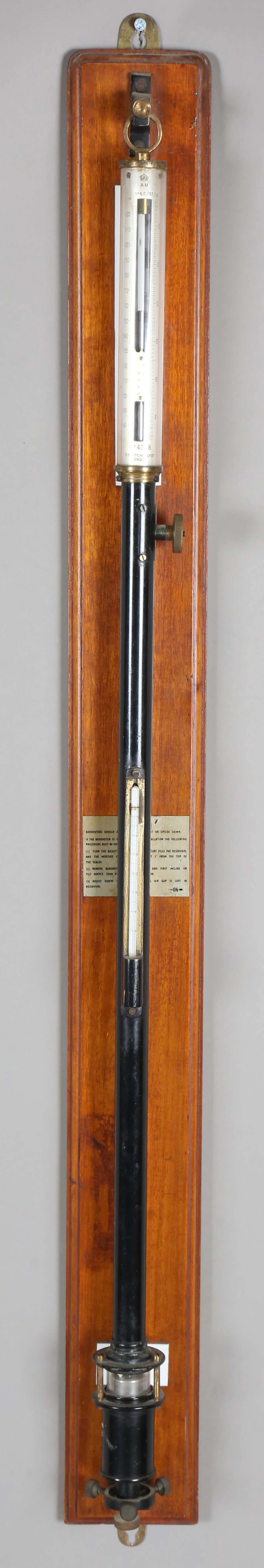 A mid-20th century Air Ministry black enamelled and silvered stick
