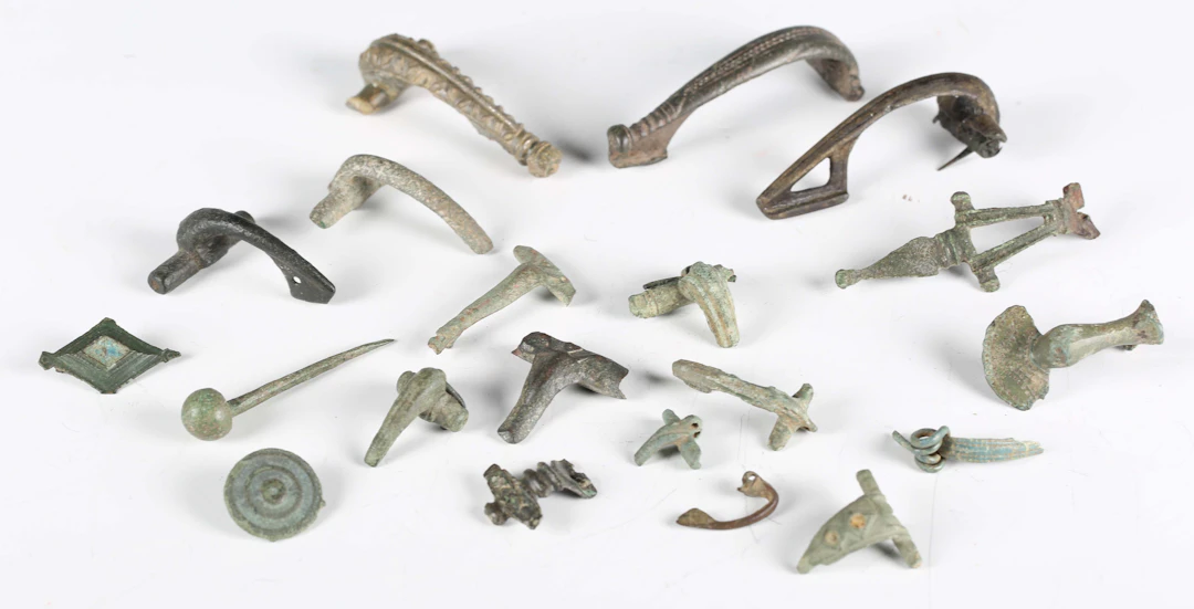 A collection of ancient Roman artefacts, including crossbow and other