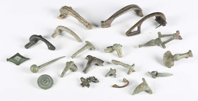 A collection of ancient Roman artefacts, including crossbow and other