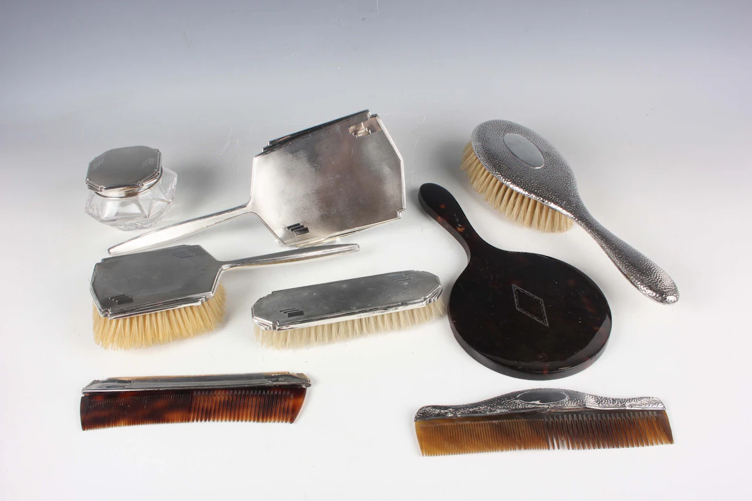 A George V silver mounted five-piece dressing table set with engine