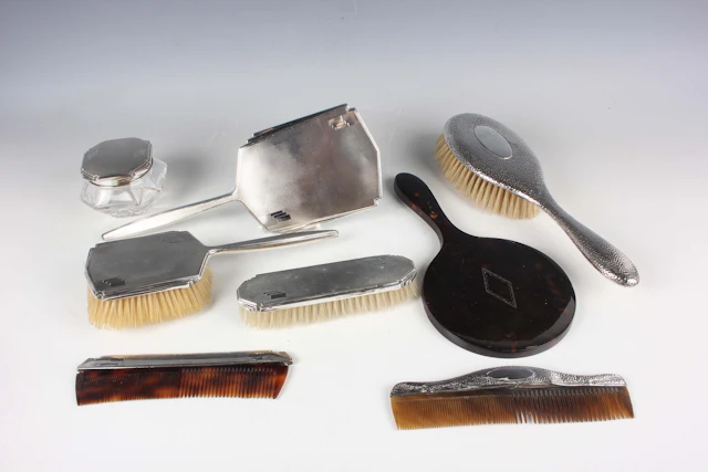 A George V silver mounted five-piece dressing table set with engine