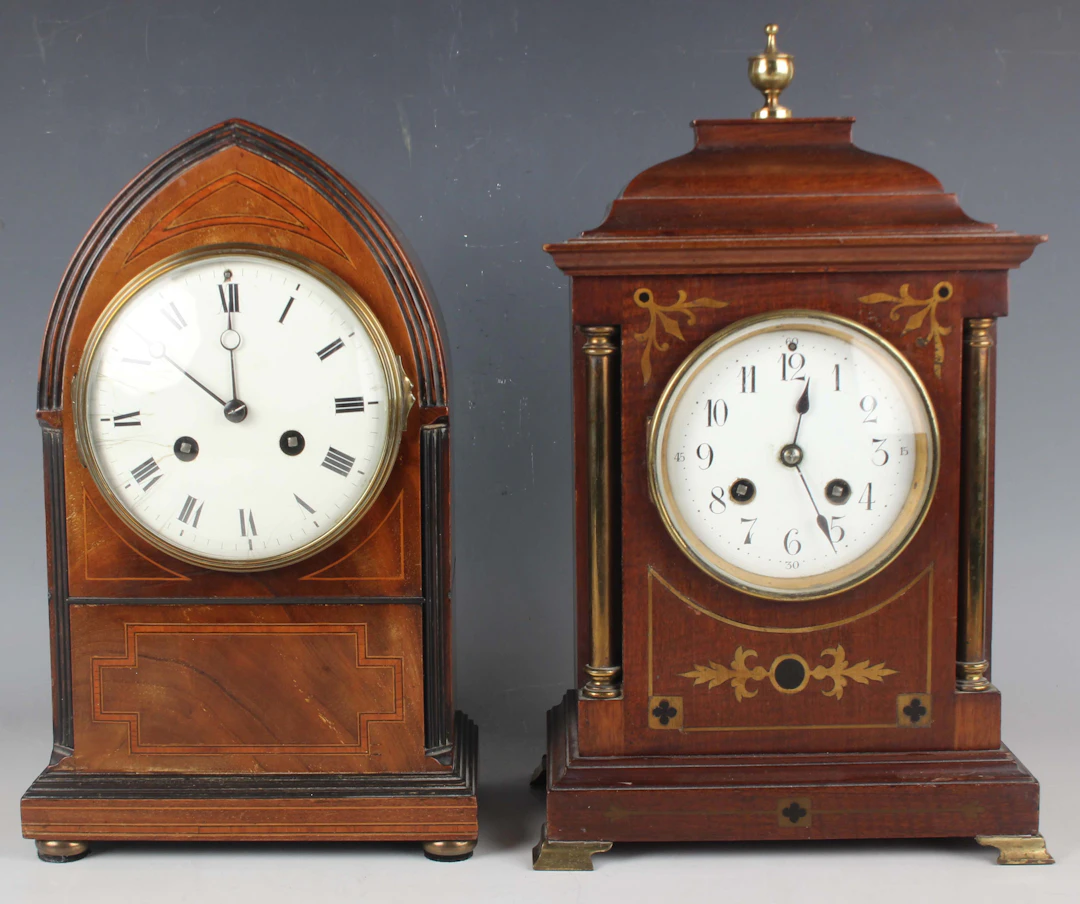 An early 20th century inlaid mahogany mantel clock with eight day