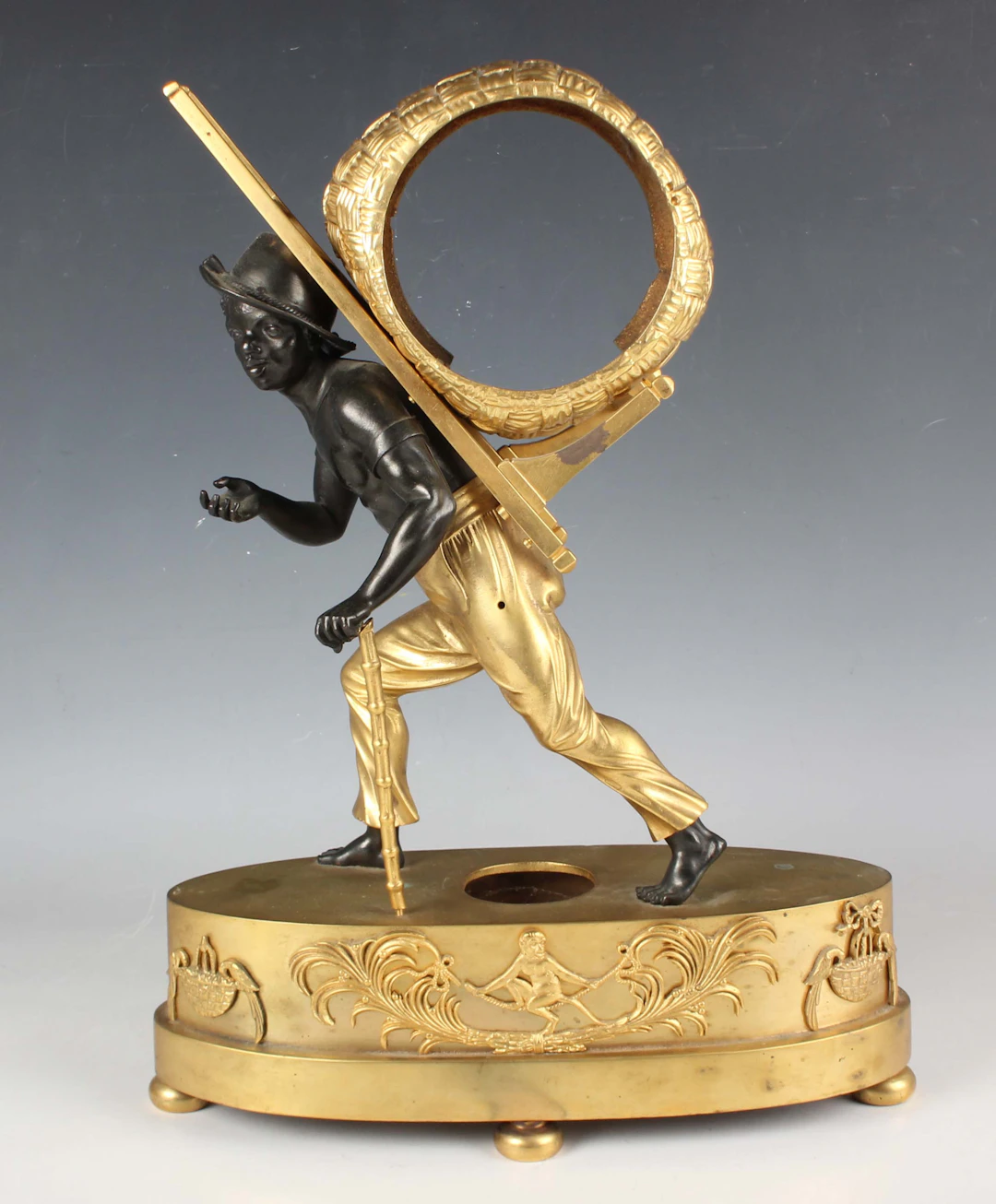 An early 19th century French ormolu and black patinated bronze mantel