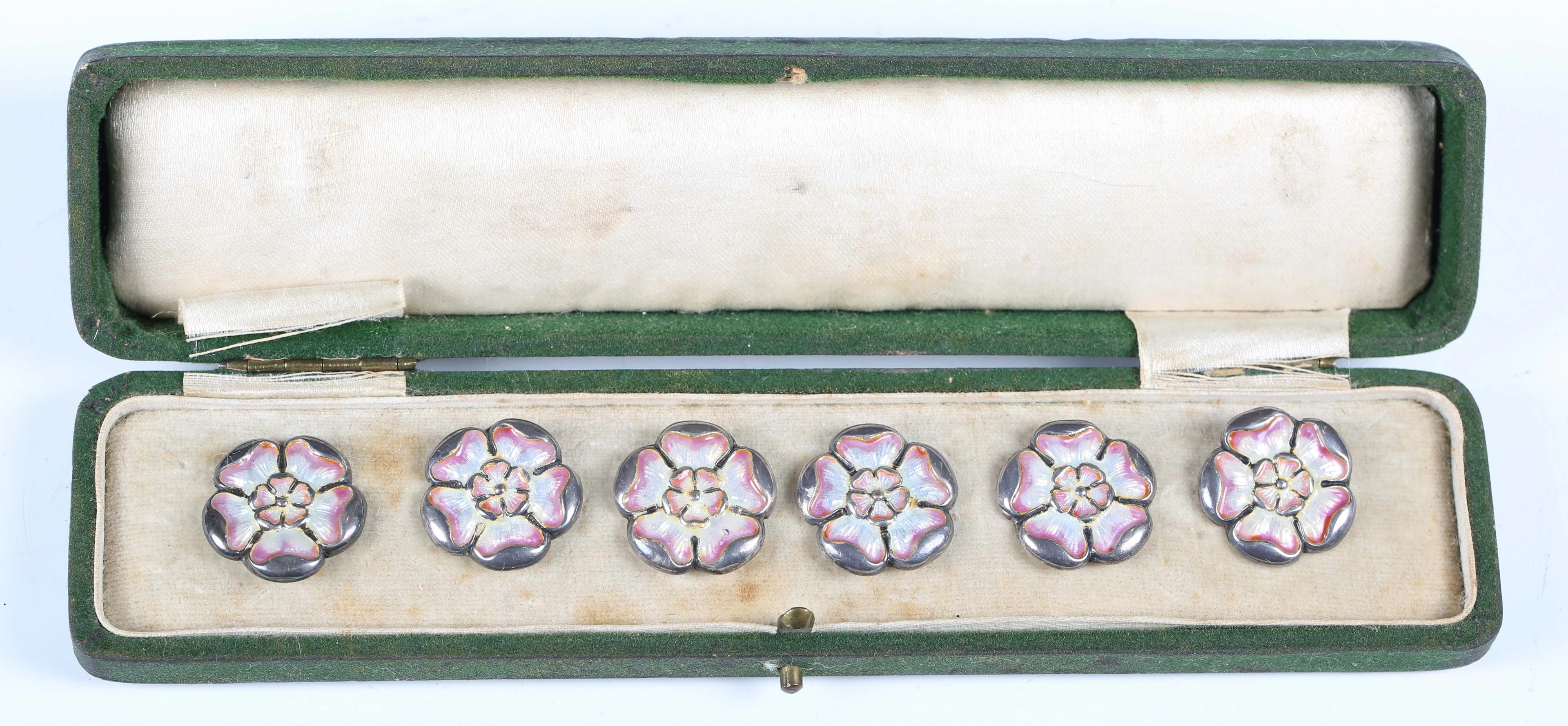 A set of six Edwardian Art Nouveau silver and enamel dress buttons