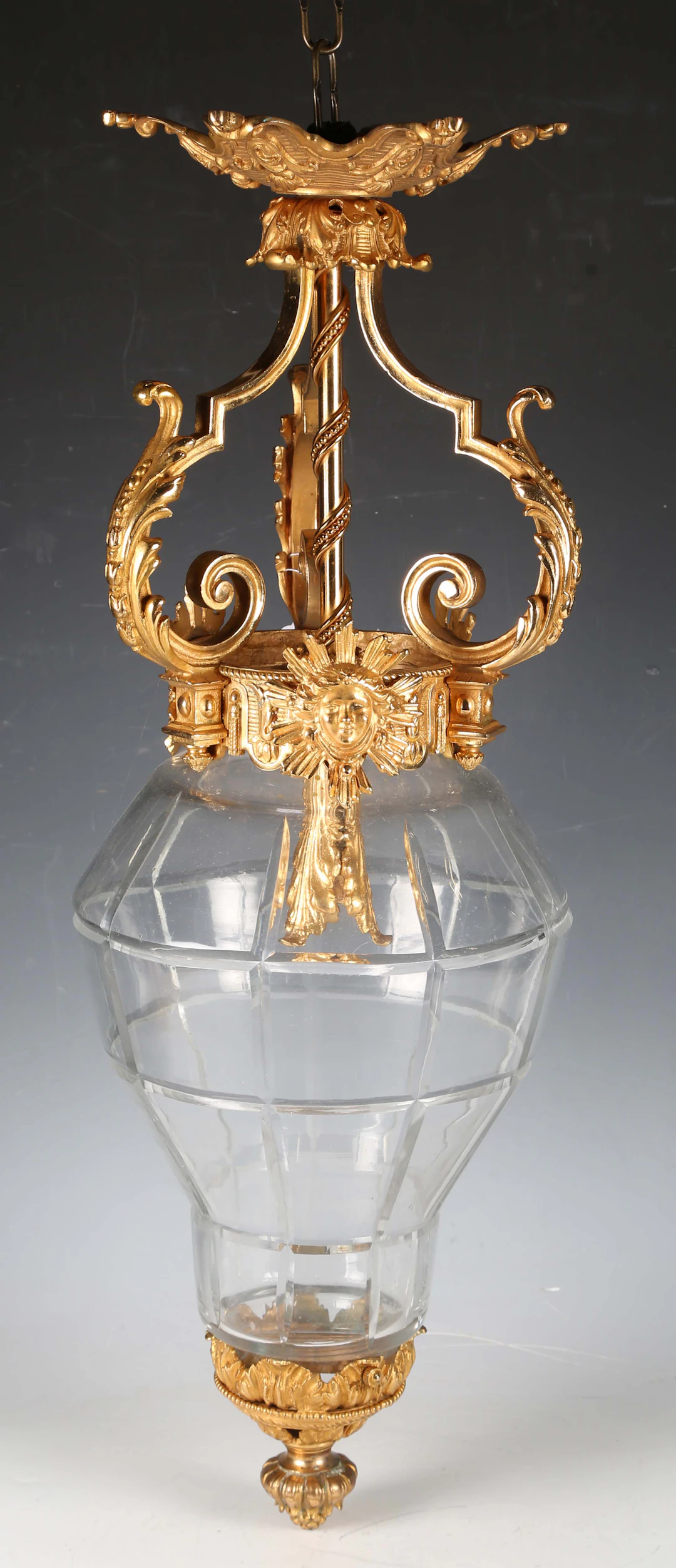 An early 20th century French cast ormolu and cut glass ceiling light