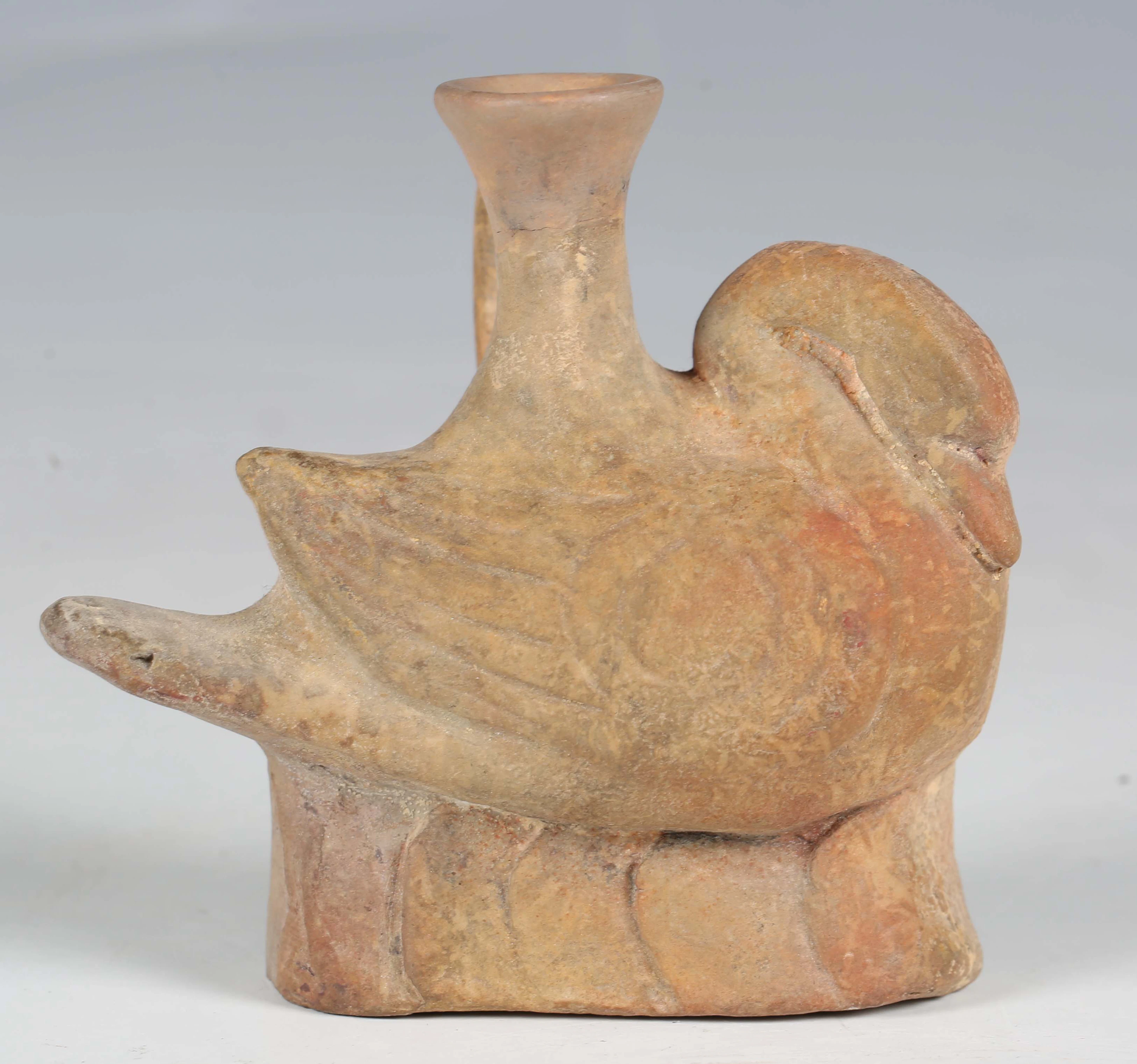 An ancient terracotta askos, possibly Greek, modelled as a swan, the