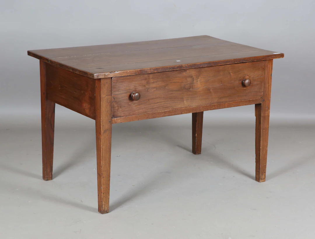 A 19th century French chestnut side table, fitted with a single frieze