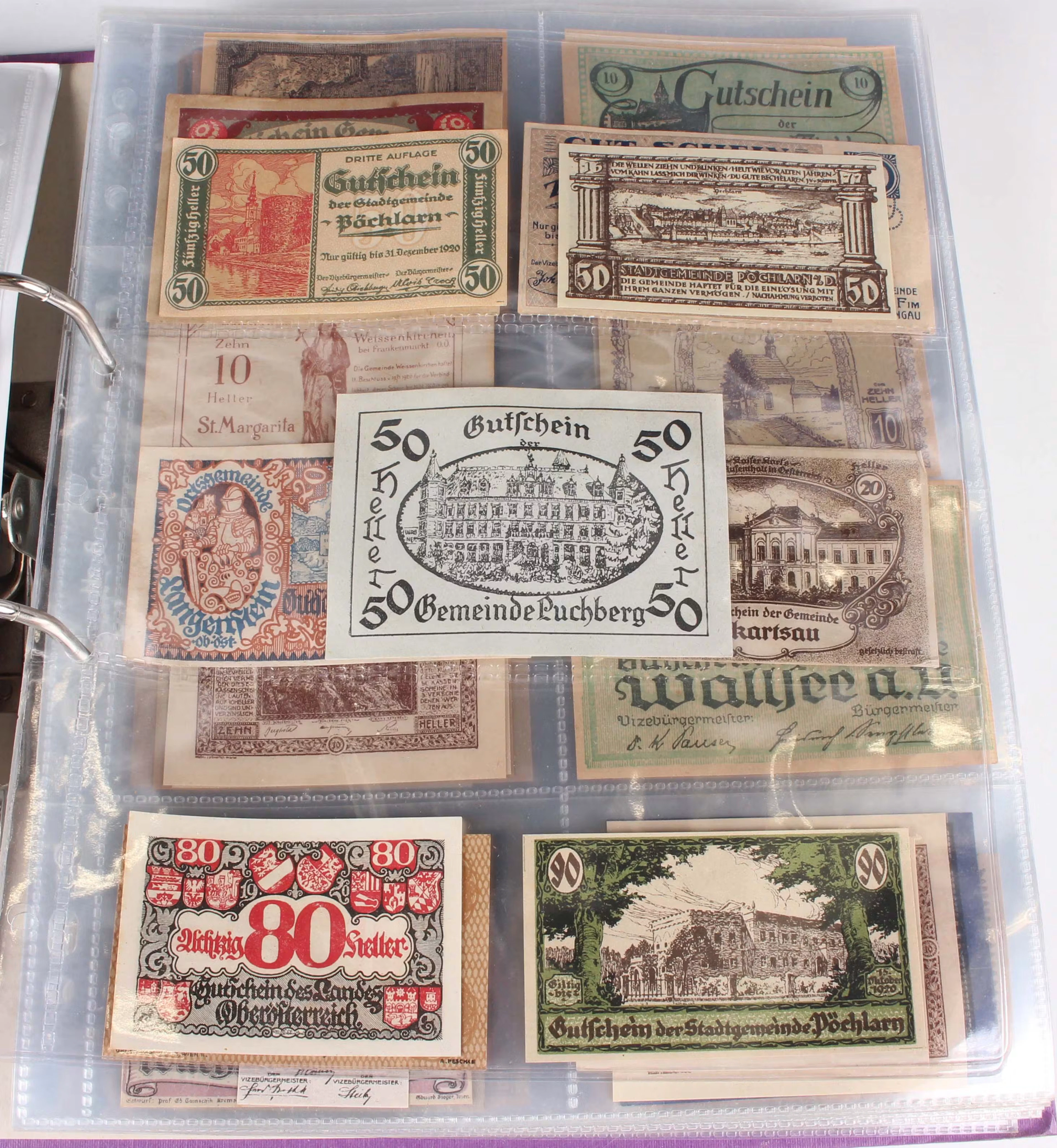 A large collection of German notgeld emergency money, within an album.