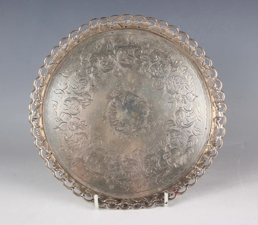 A 19th century Portuguese silver circular card salver, the centre