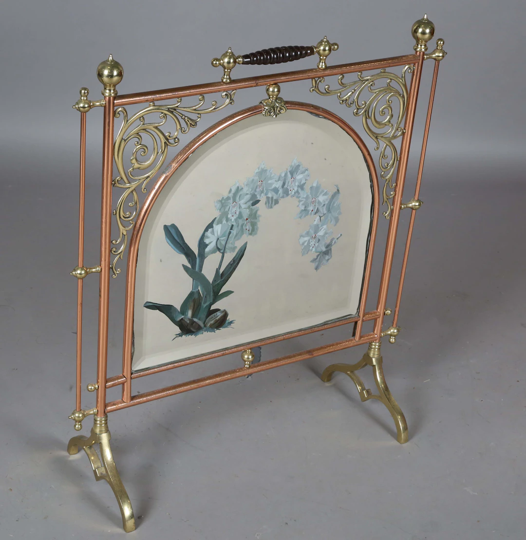 A late Victorian Aesthetic Movement brass and copper framed firescreen